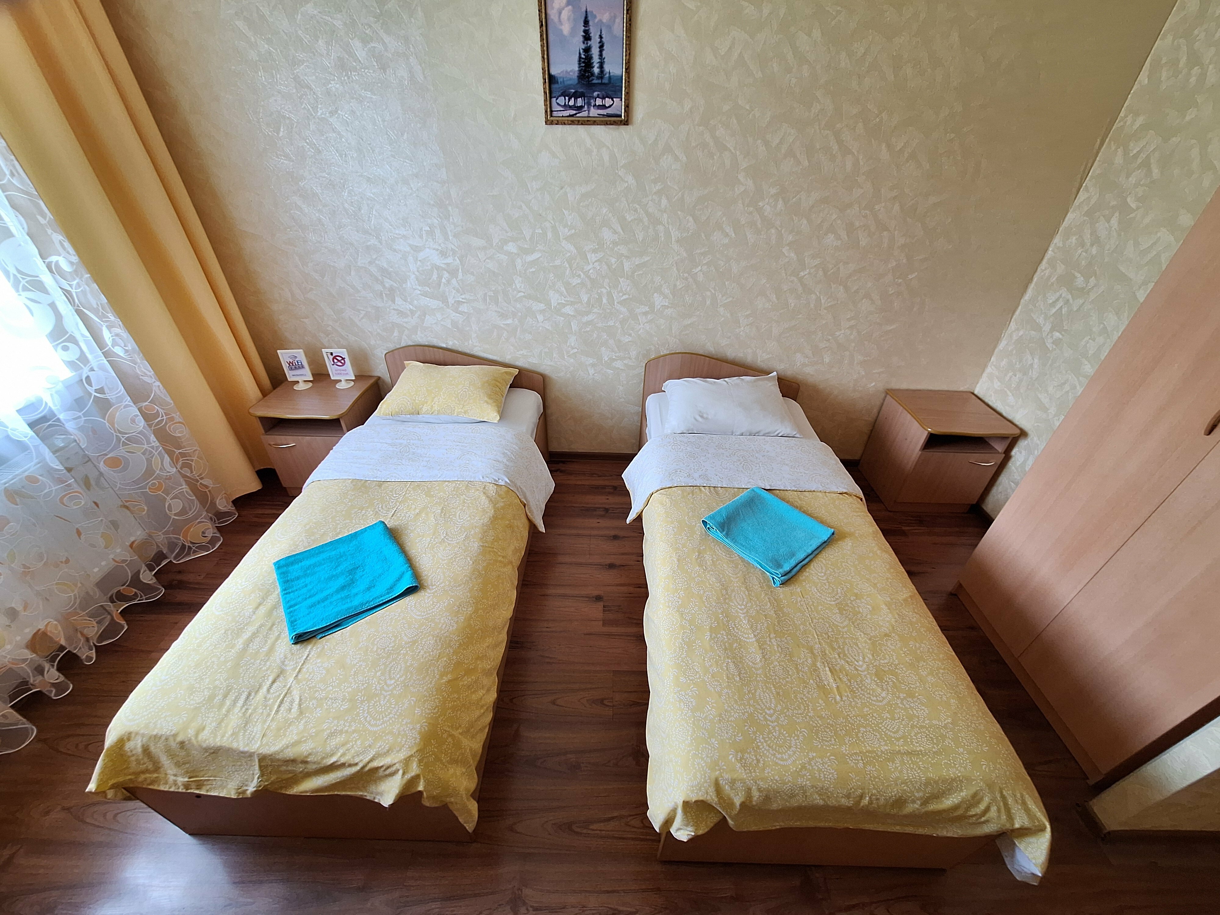 Двухместный номер с 2 отдельными кроватями и душем