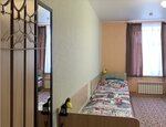 Кровать в 5-местном общем номере в Компас