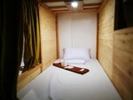 Общее спальное помещение (Semi Private Curtained Capsule) в 8th Street Hostel