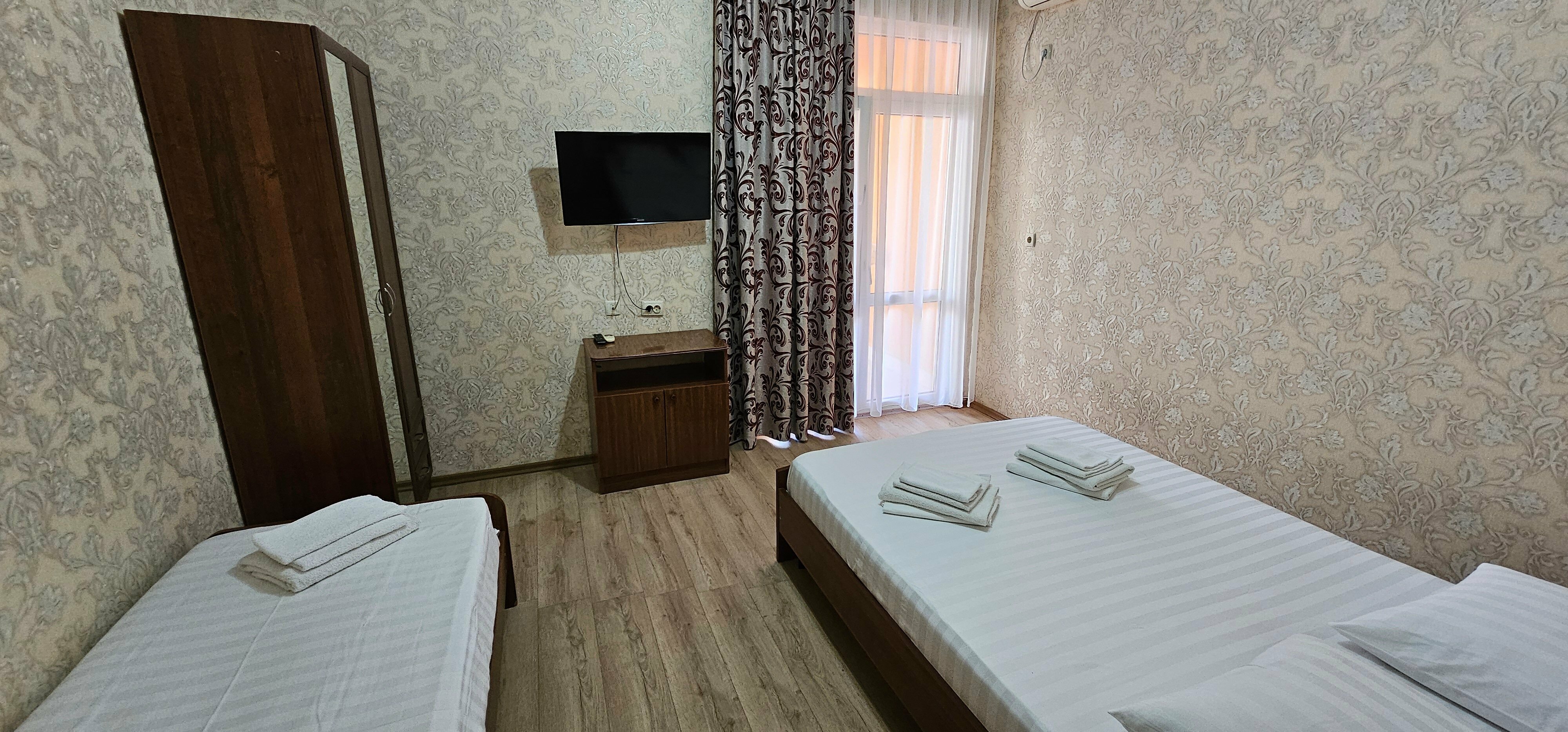 Трехместный номер с балконом