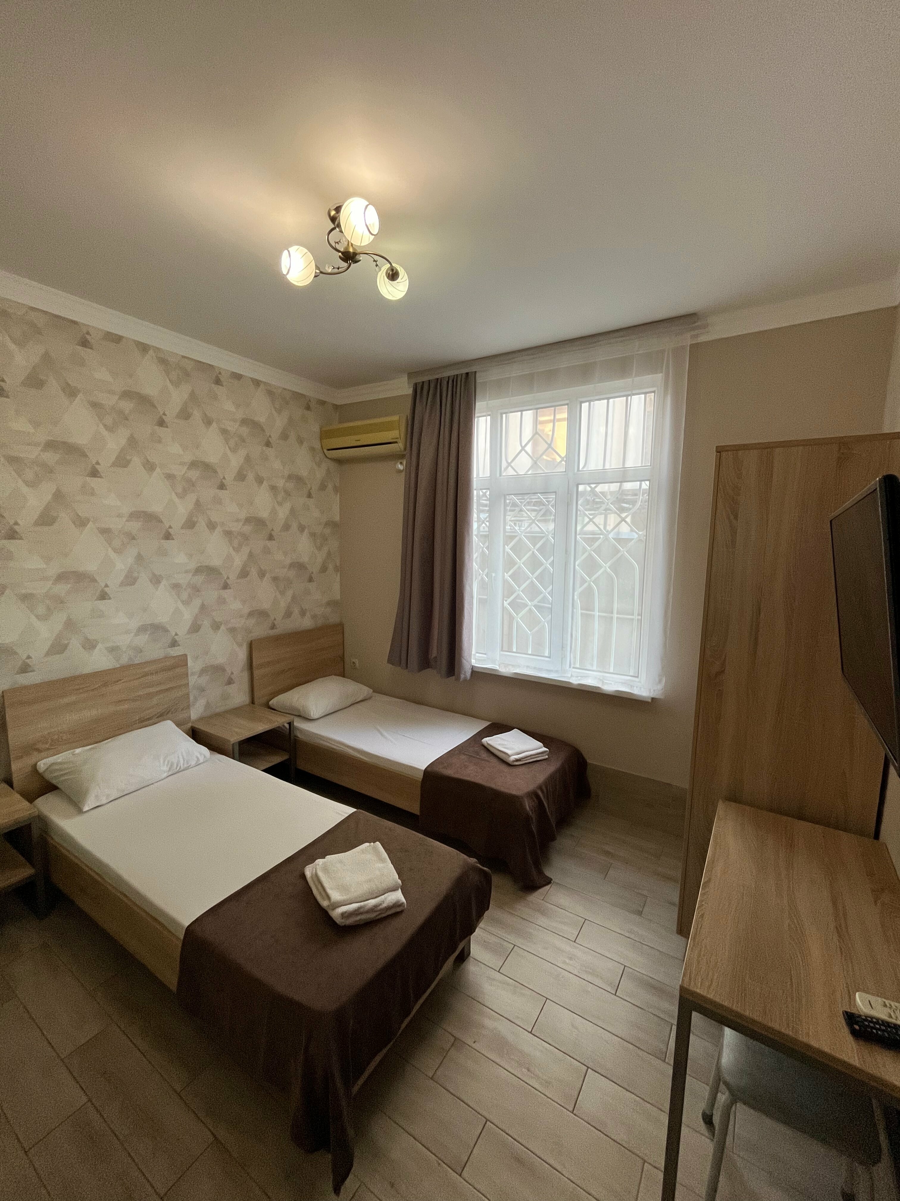 Улучшенный двухместный номер с 2 отдельными кроватями