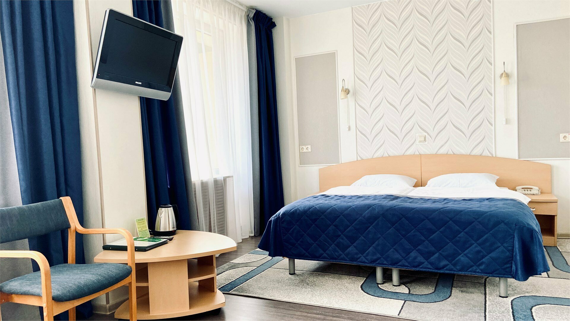 Улучшенный о одной двухспальной или двумя односпальными кроватями