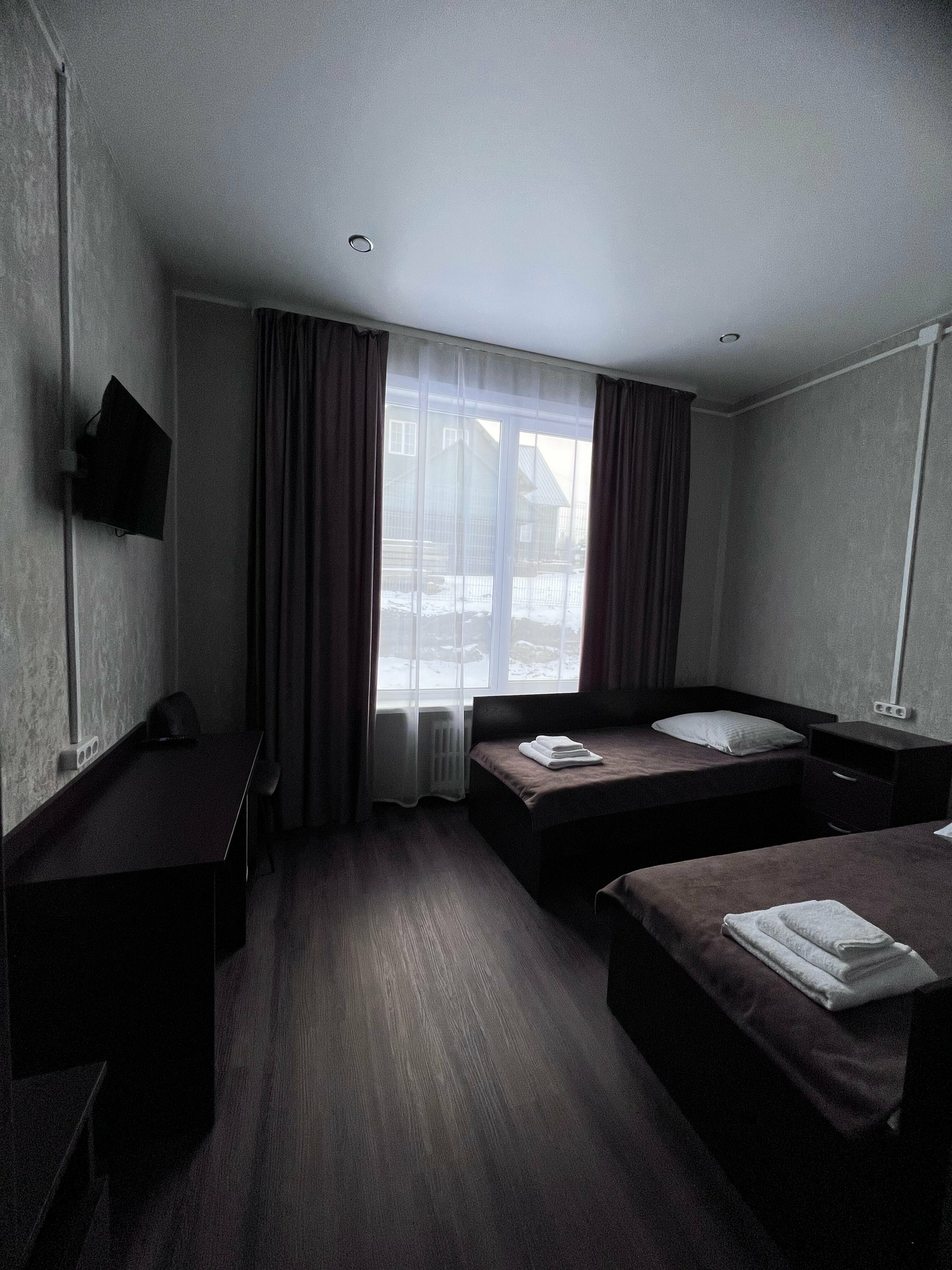 Двухместный номер с 2 отдельными кроватями и окном