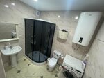 Четырехместный номер с ванной комнатой в Уют