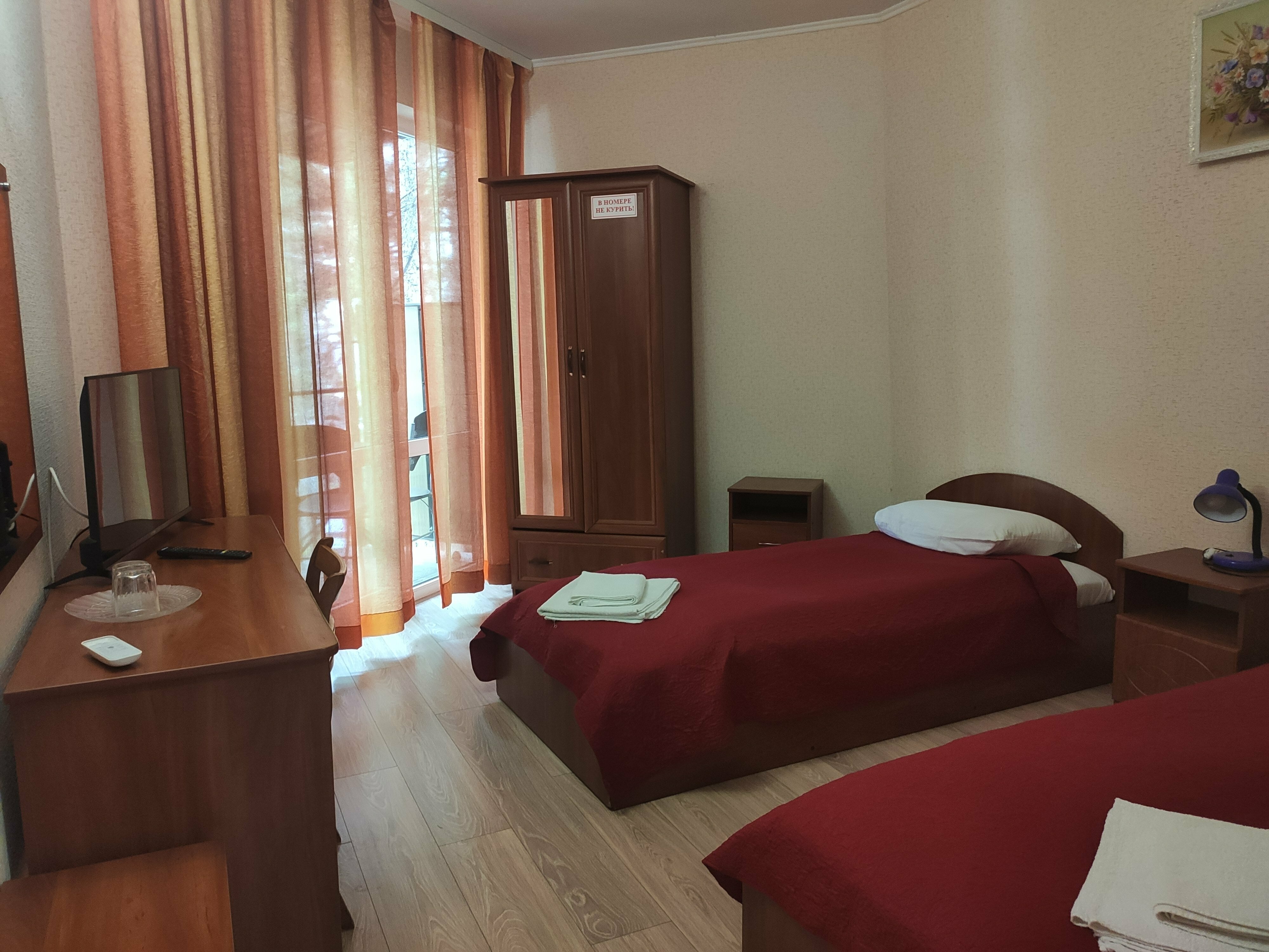 Двухместный номер с 2 отдельными кроватями и балконом