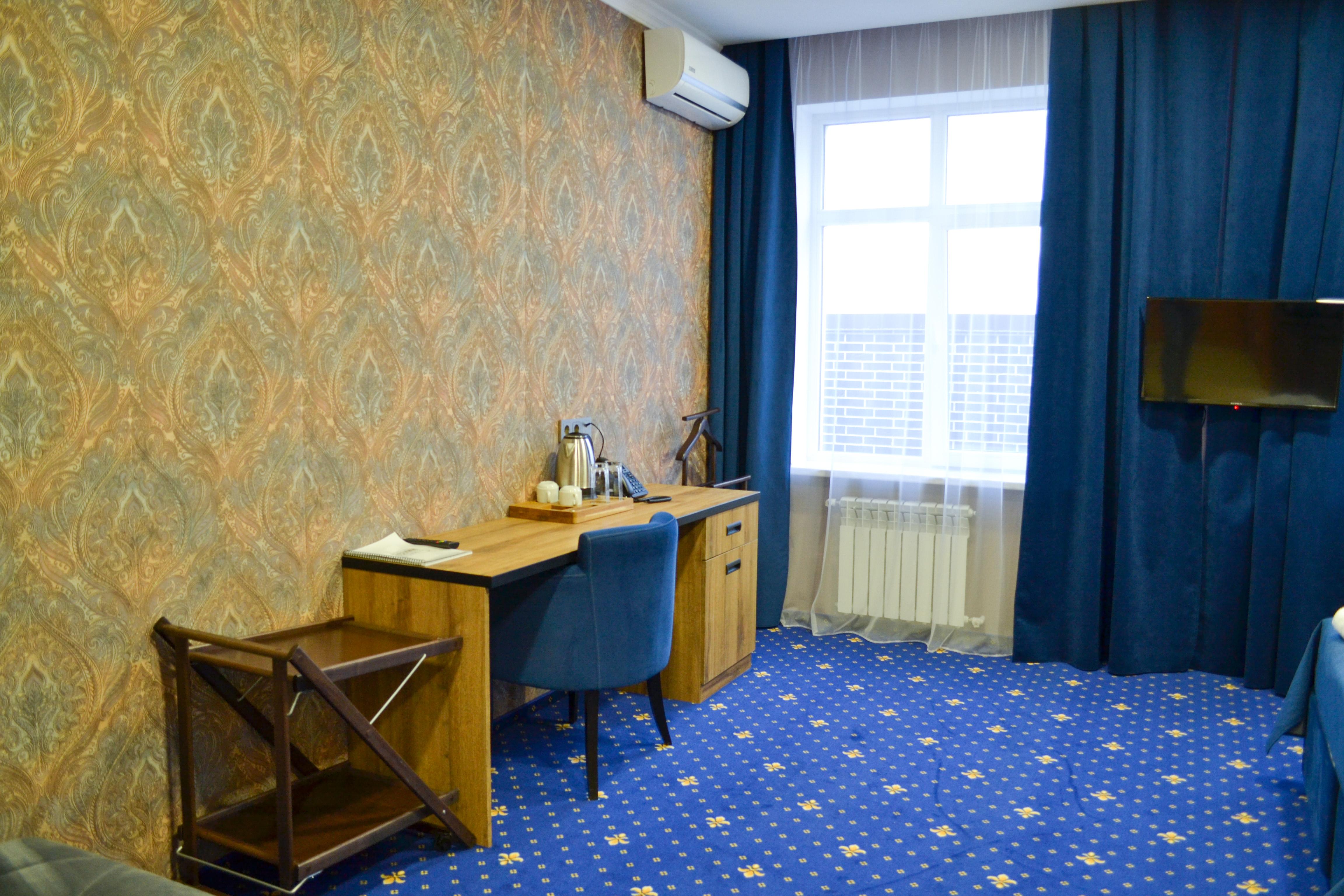 Номер категории "Студио" с мини-кухней и диваном (с двумя раздельными или одной кроватью queen size)