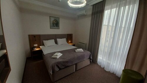 Двухместный номер с 1 кроватью или 2 отдельными кроватями в Магнат