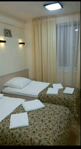 Небольшой двухместный номер с 2 отдельными кроватями в Стрекоза