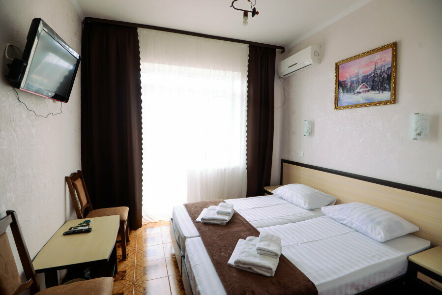 Двухместный номер с 2 отдельными кроватями и балконом