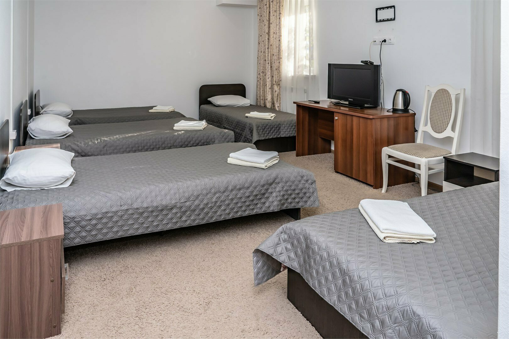 Стандарт Четырехместный с 4 односпальными кроватями