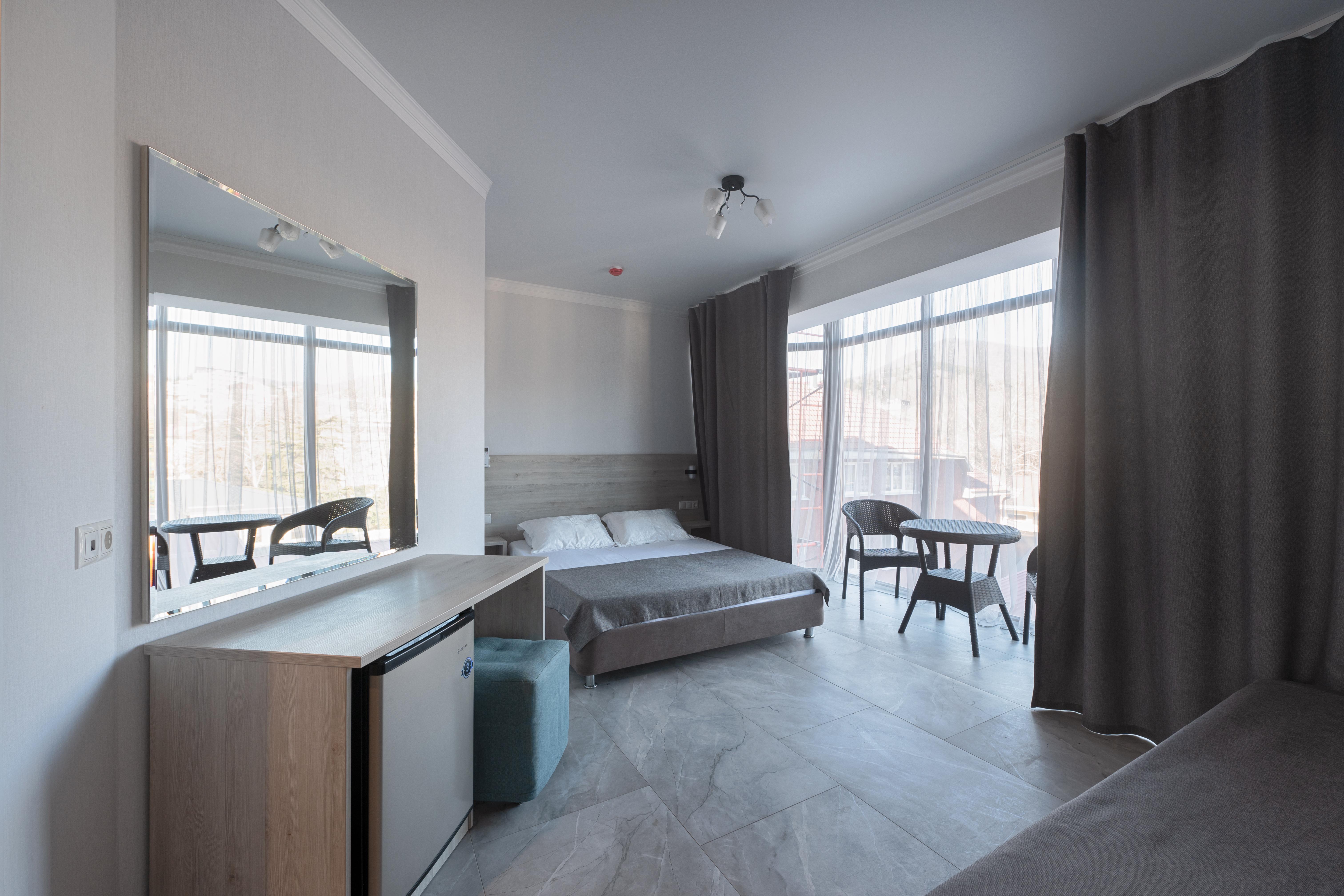 Трехместный номер с балконом