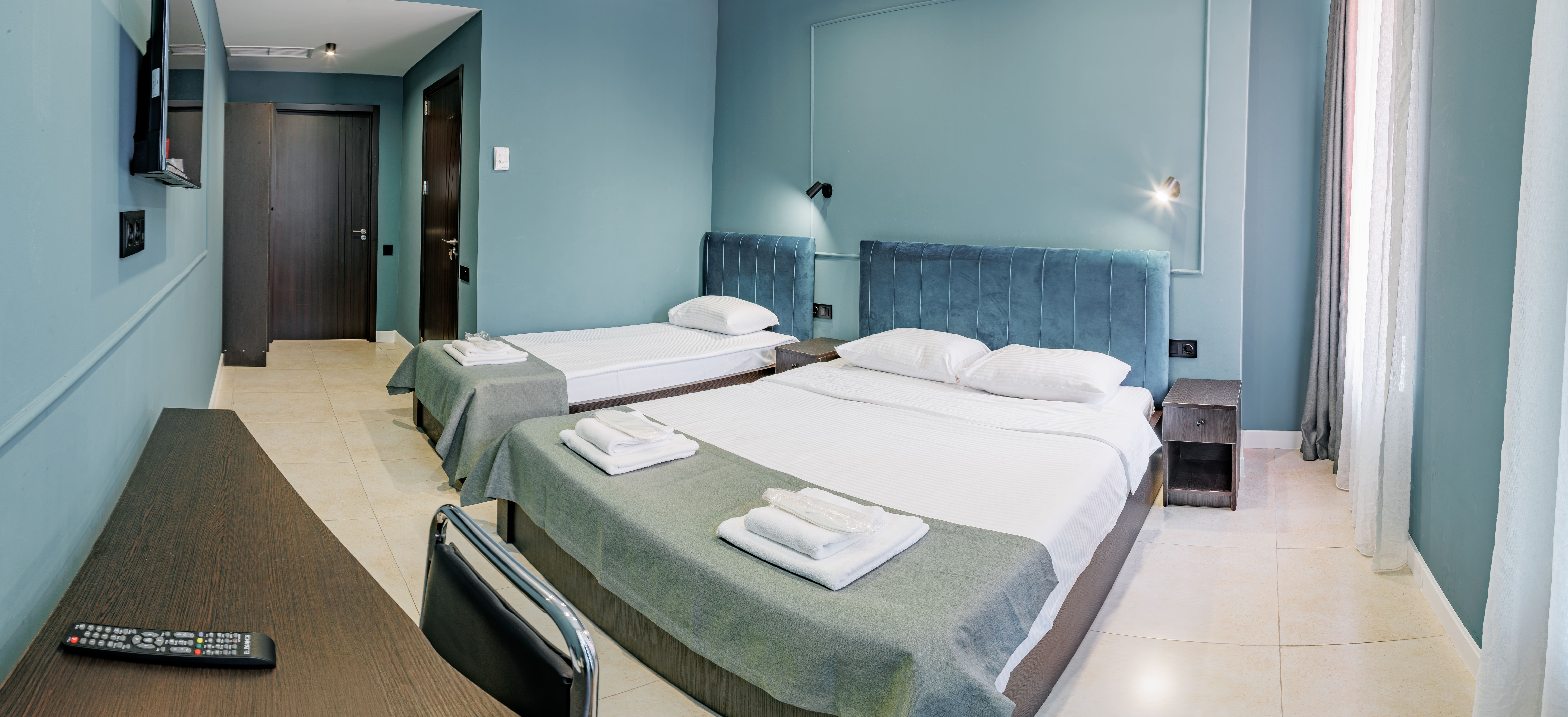 Трехместный номер Делюкс