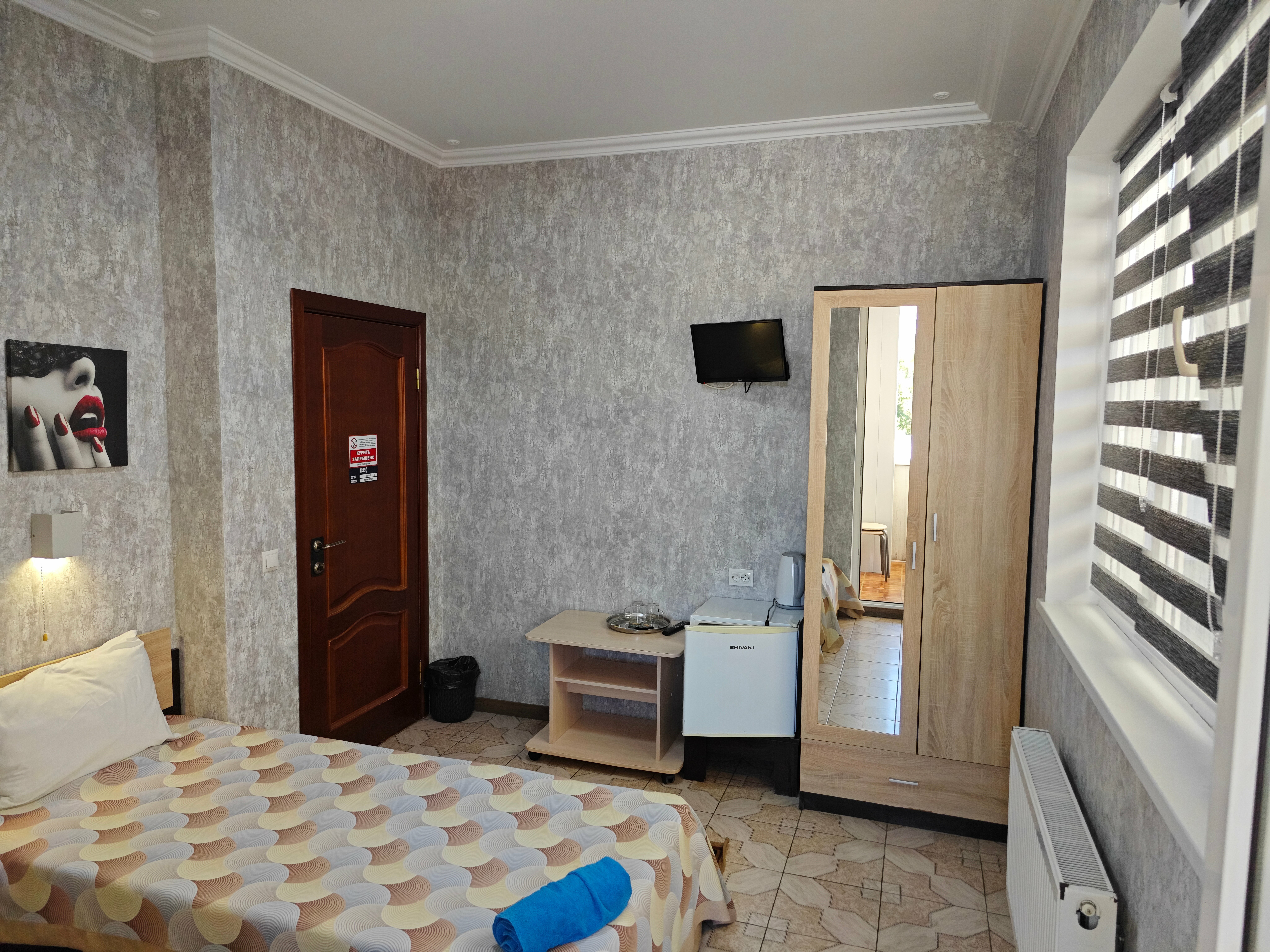 Двухместный номер с 2 отдельными кроватями и общей ванной комнатой