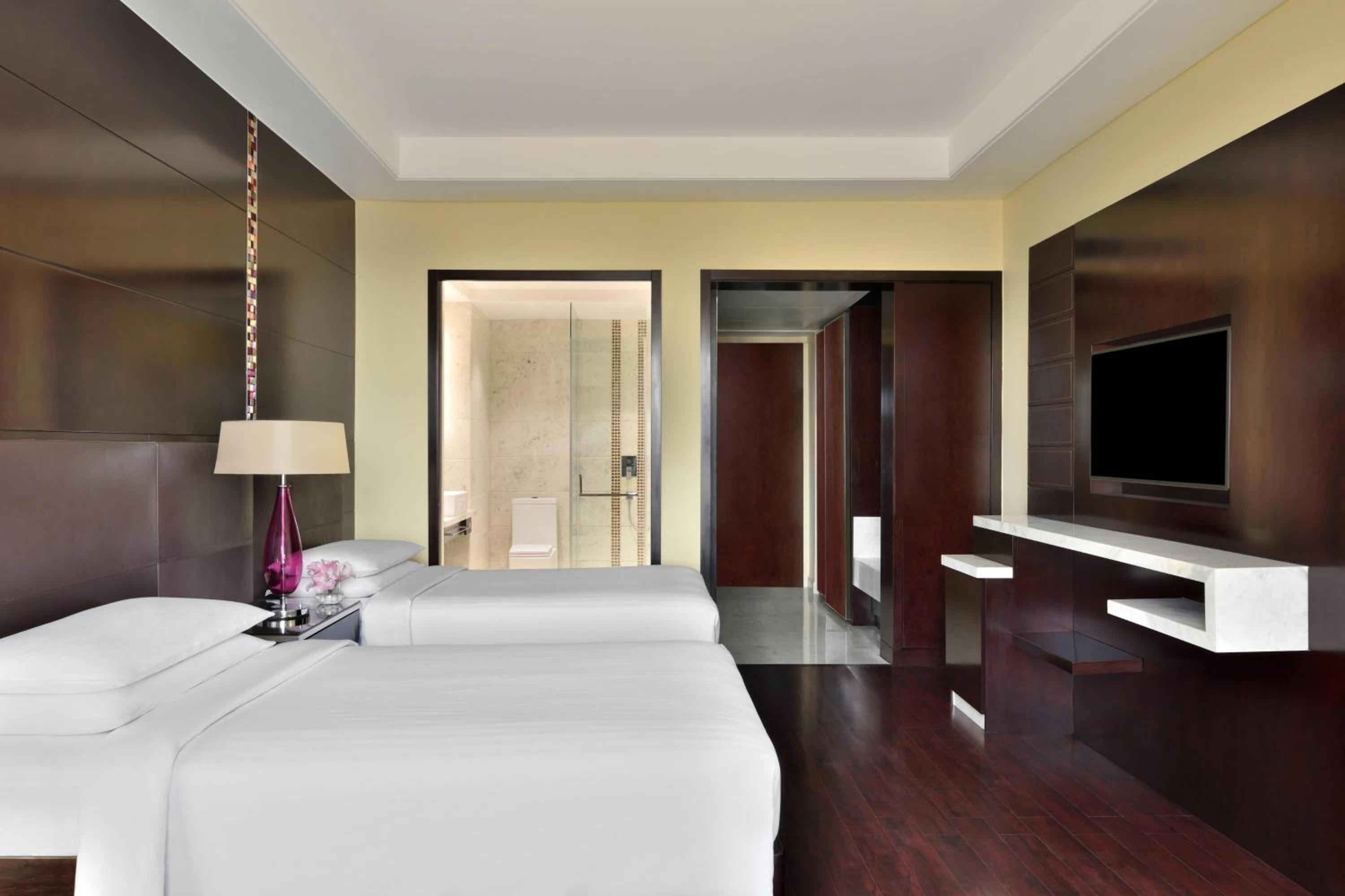 Deluxe Guest Twin Room with Bath Tub, 30% discount on Spa treatments during 12:00 PM to 3PM (Not valid in conjunction with any other spa inclusion), Buy one and get one beer on selected brands during 12PM – 6PM at Lounge 18