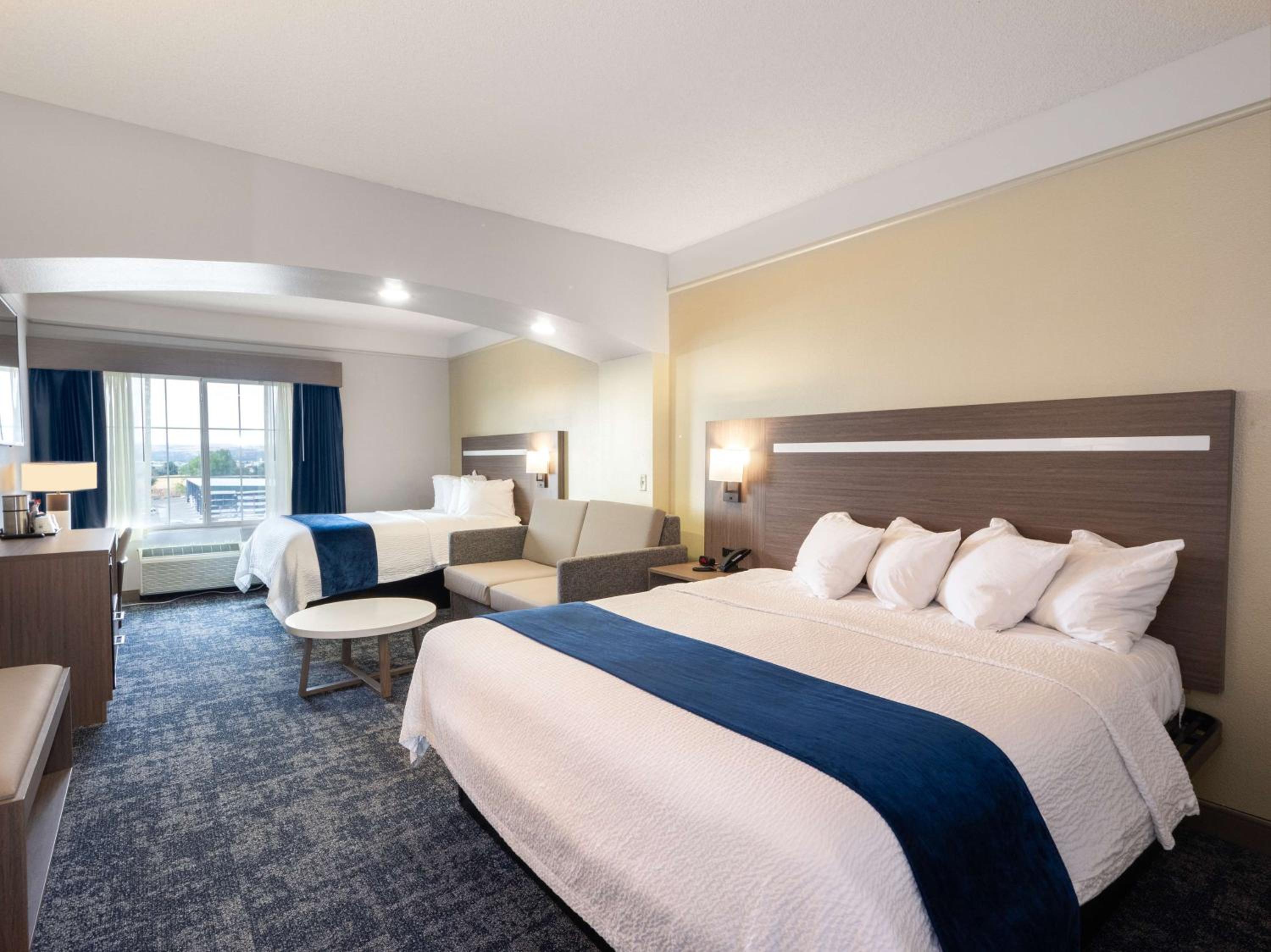 Larger Room with One King and One Queen Bed and Sofa - Non-Smoking