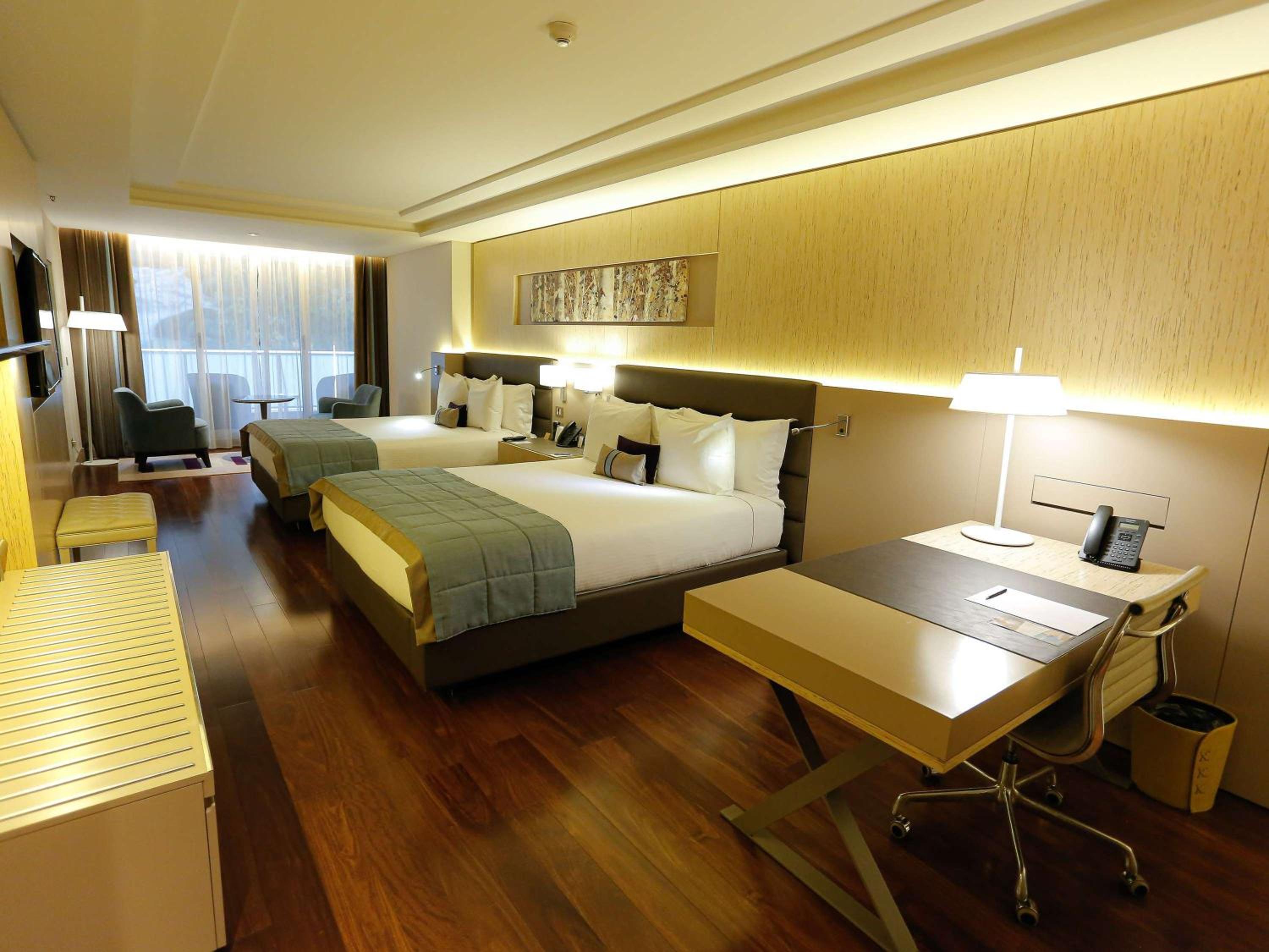 Deluxe Suite with Two Double Beds, Balcony and Park View