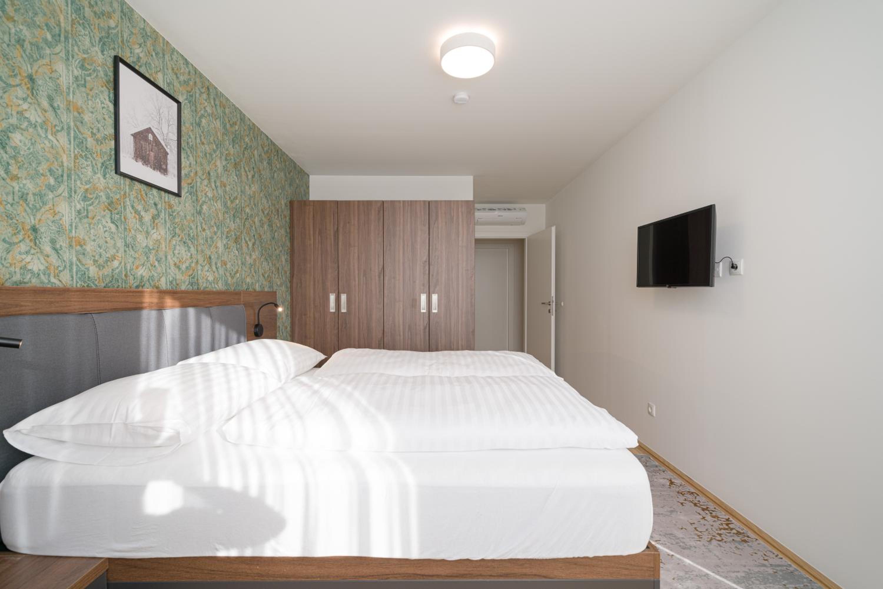 Four-Bedroom Apartment with Balcony 