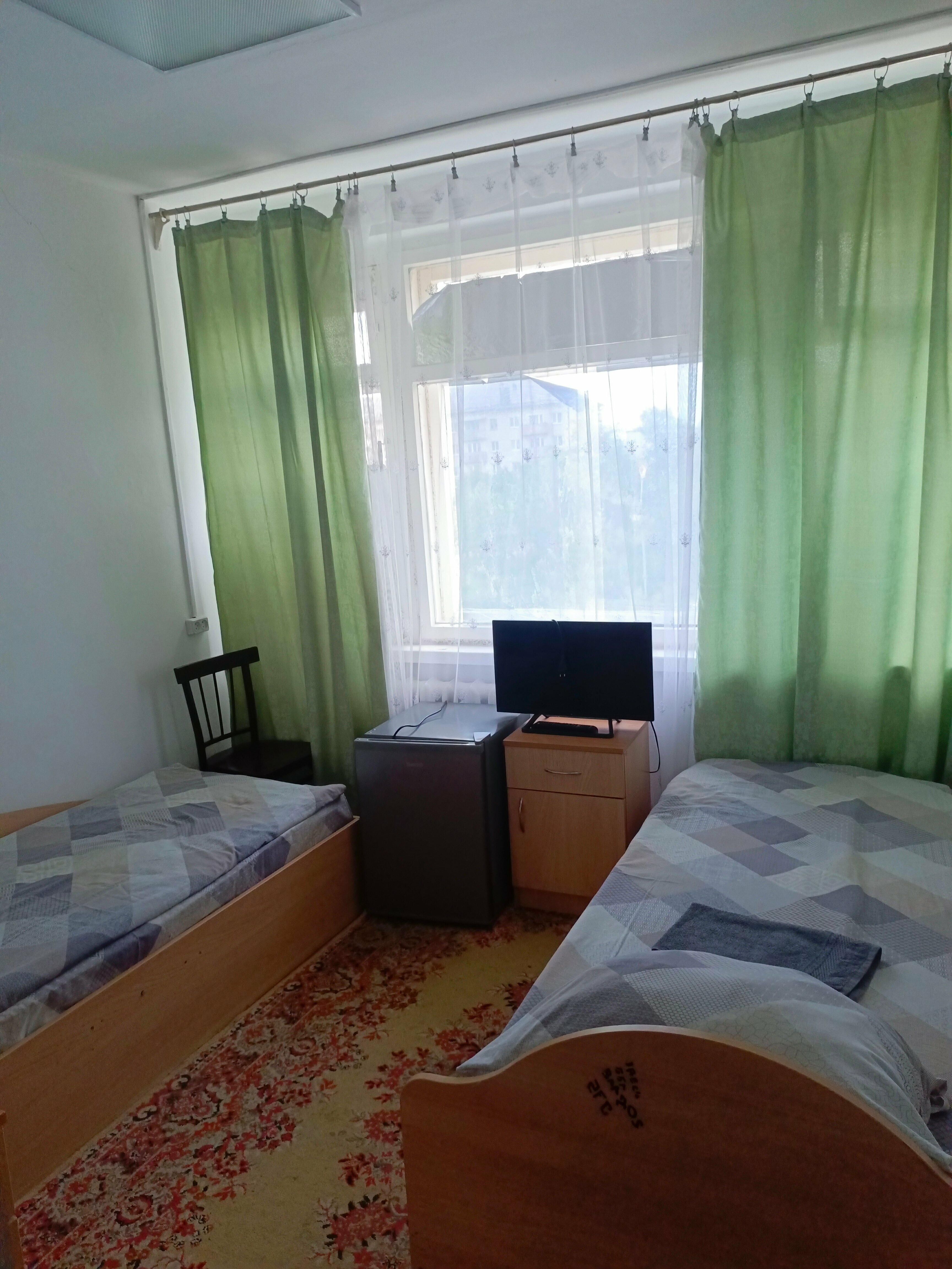 Стандартный двухместный номер с двумя односпальными кроватями