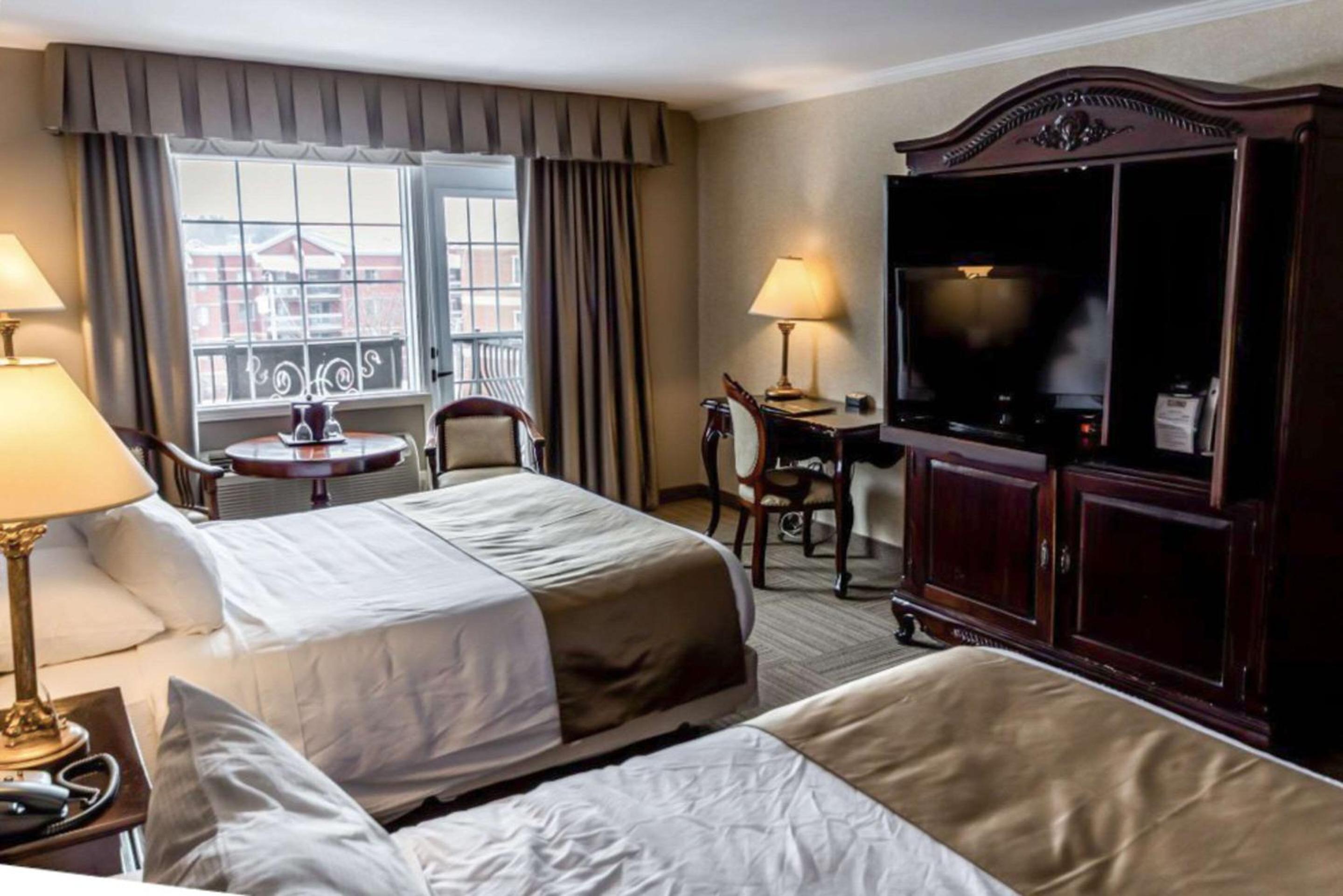 Superior Two Queen Beds with Partial Lake View