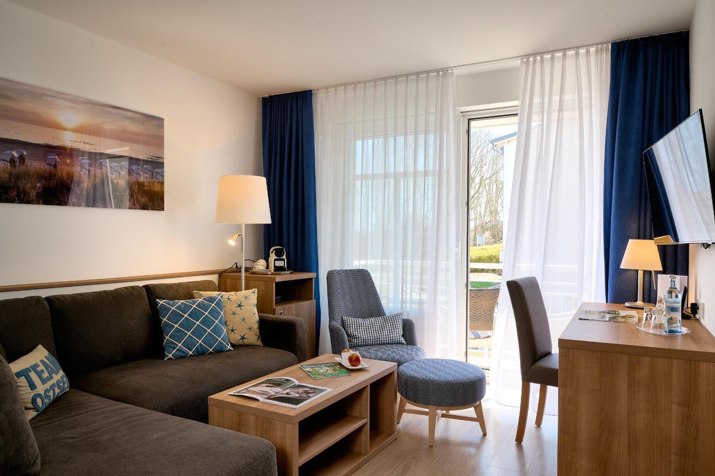 Suite with Balcony and Side View of the Sea