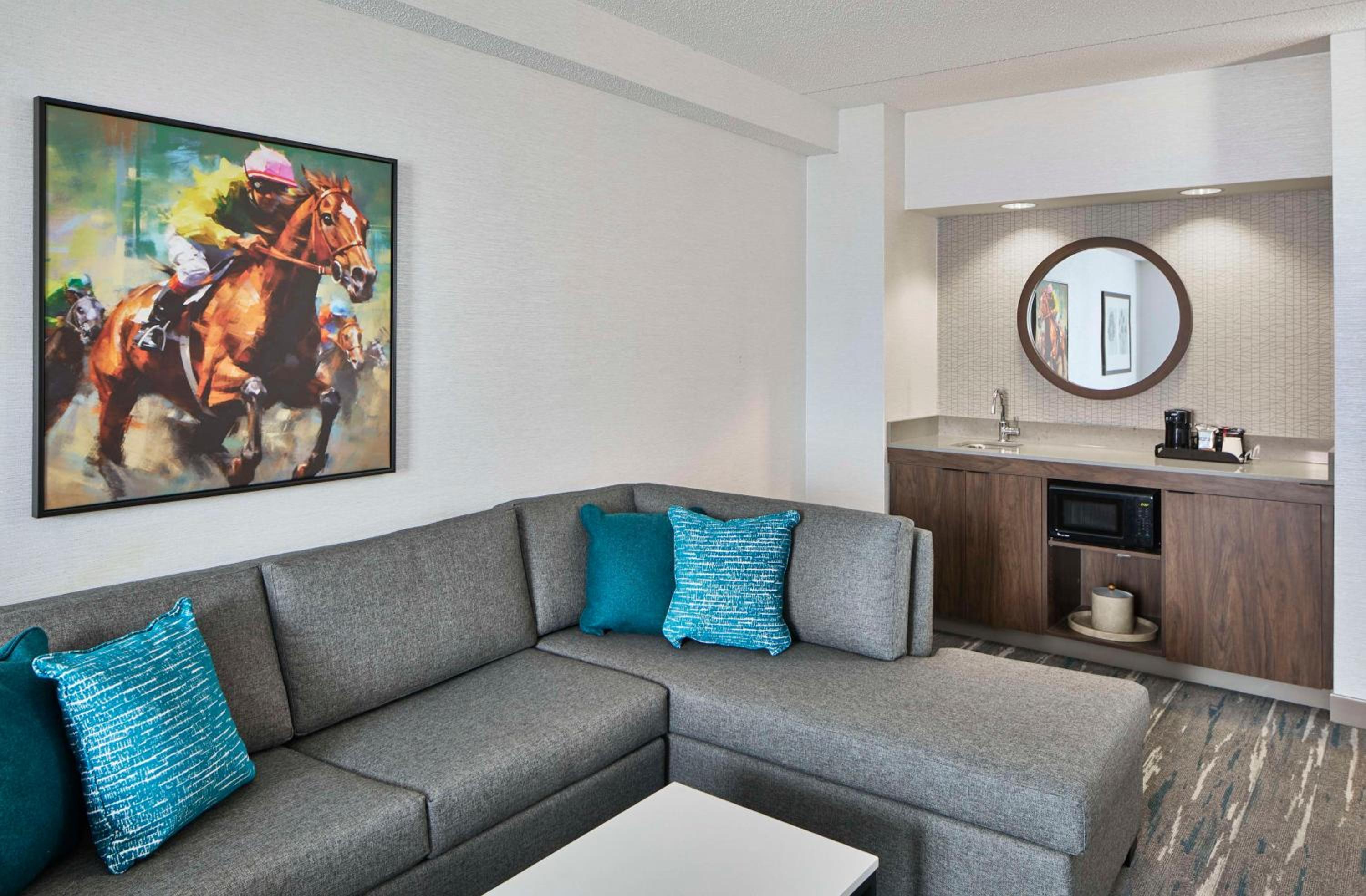 Deluxe King Suite Sofa Bed and Dining Area