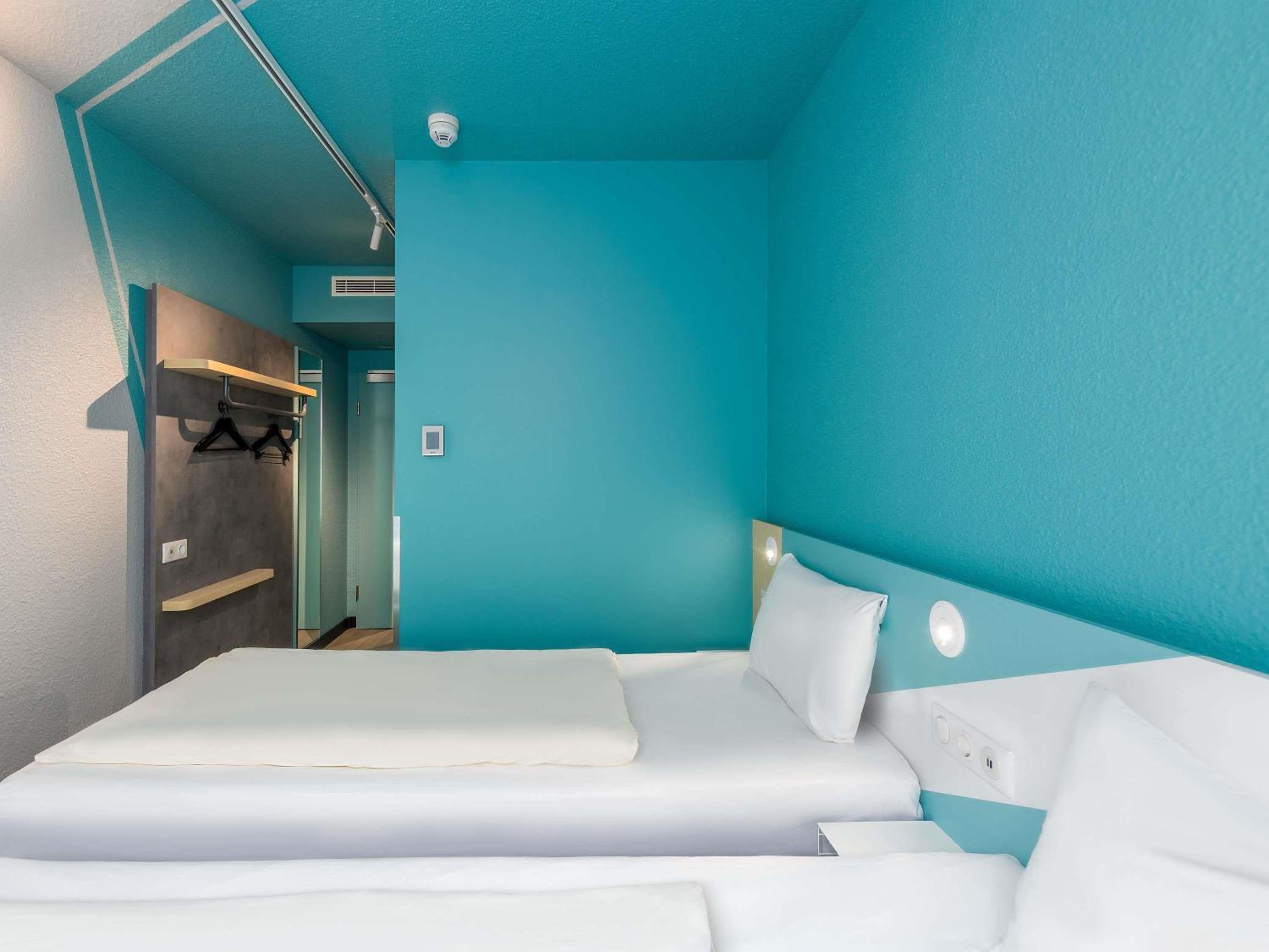 Small twin room with private bathroom and toilet