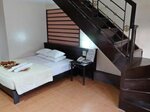 Panorama Deluxe Room with Four Beds в La Carmela De Boracay Resort Hotel