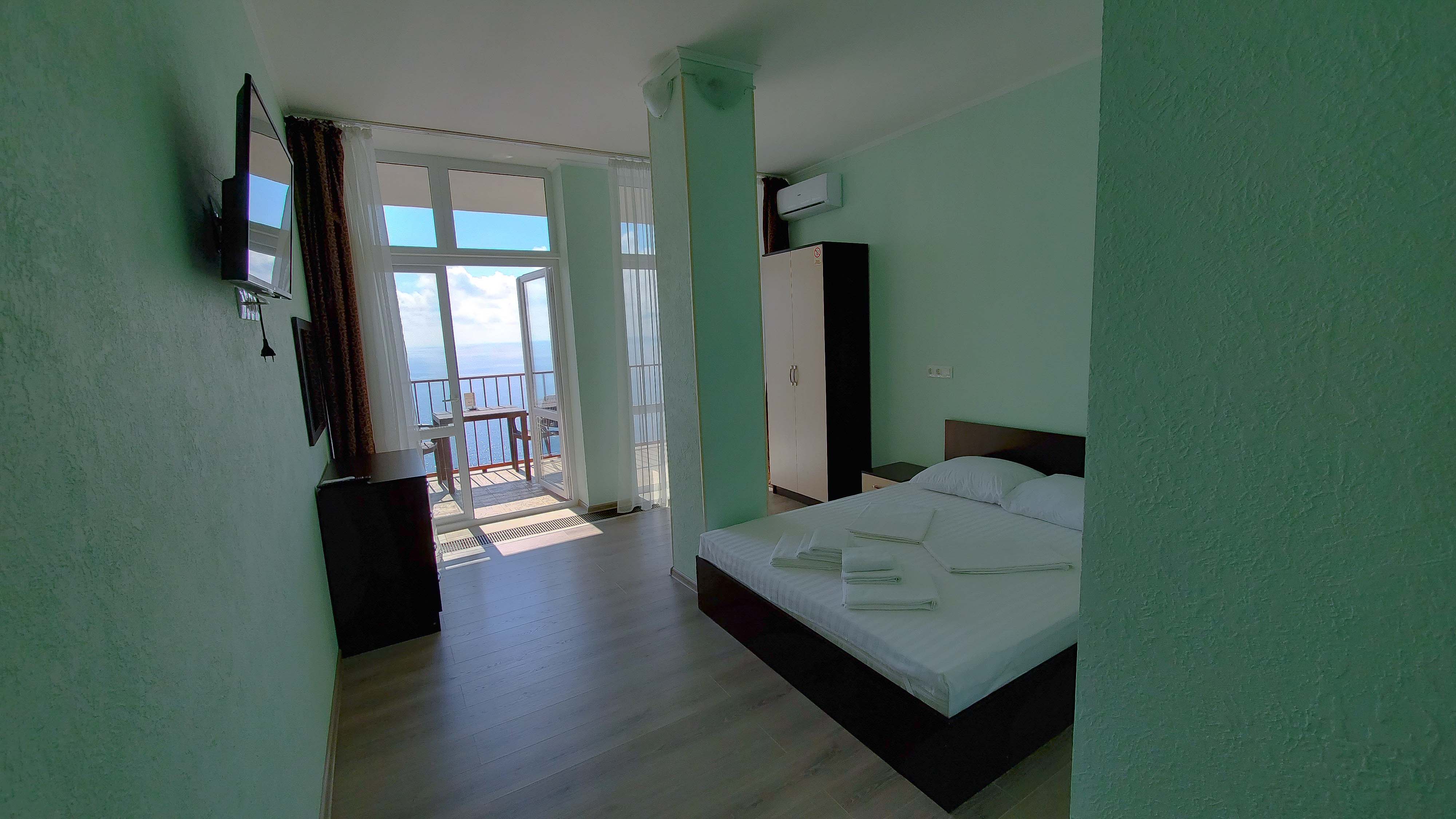 Двухместный однокомнатный люкс с кухней и видом на море