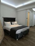 Standard Quadruple Room with Private Garden ( Underground Floor) в Hotel Efzen