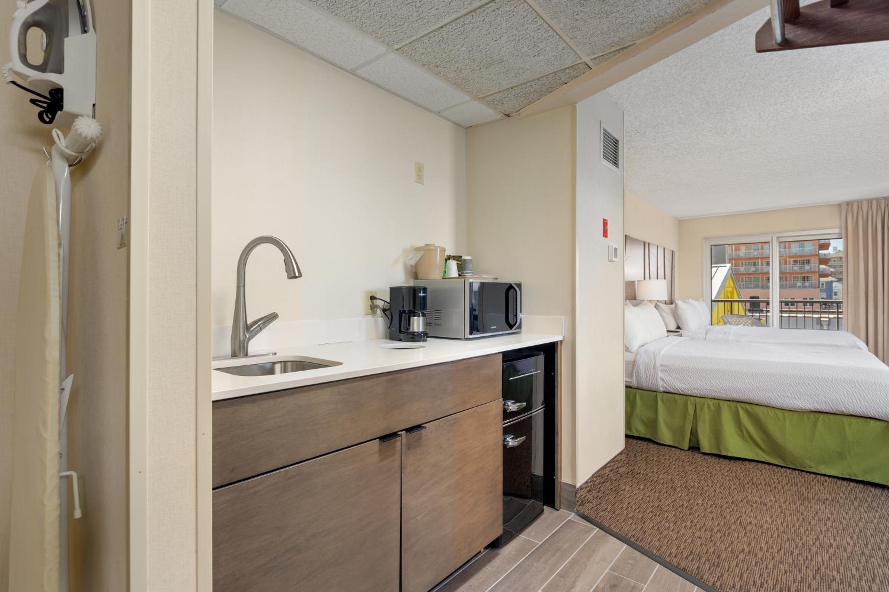 Standard Queen Room with Balcony and Side City view