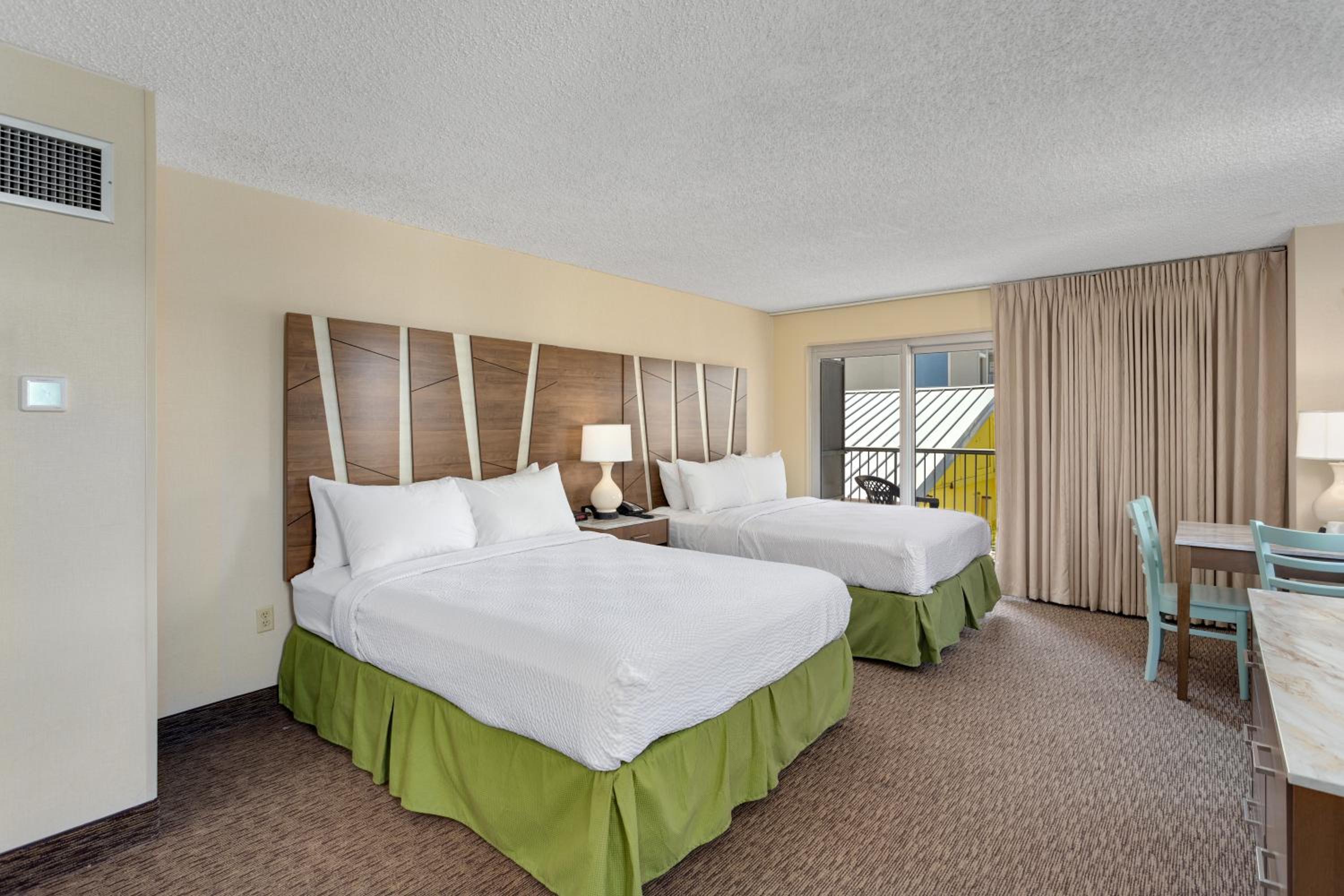 Standard Queen Room with Balcony and Side City view