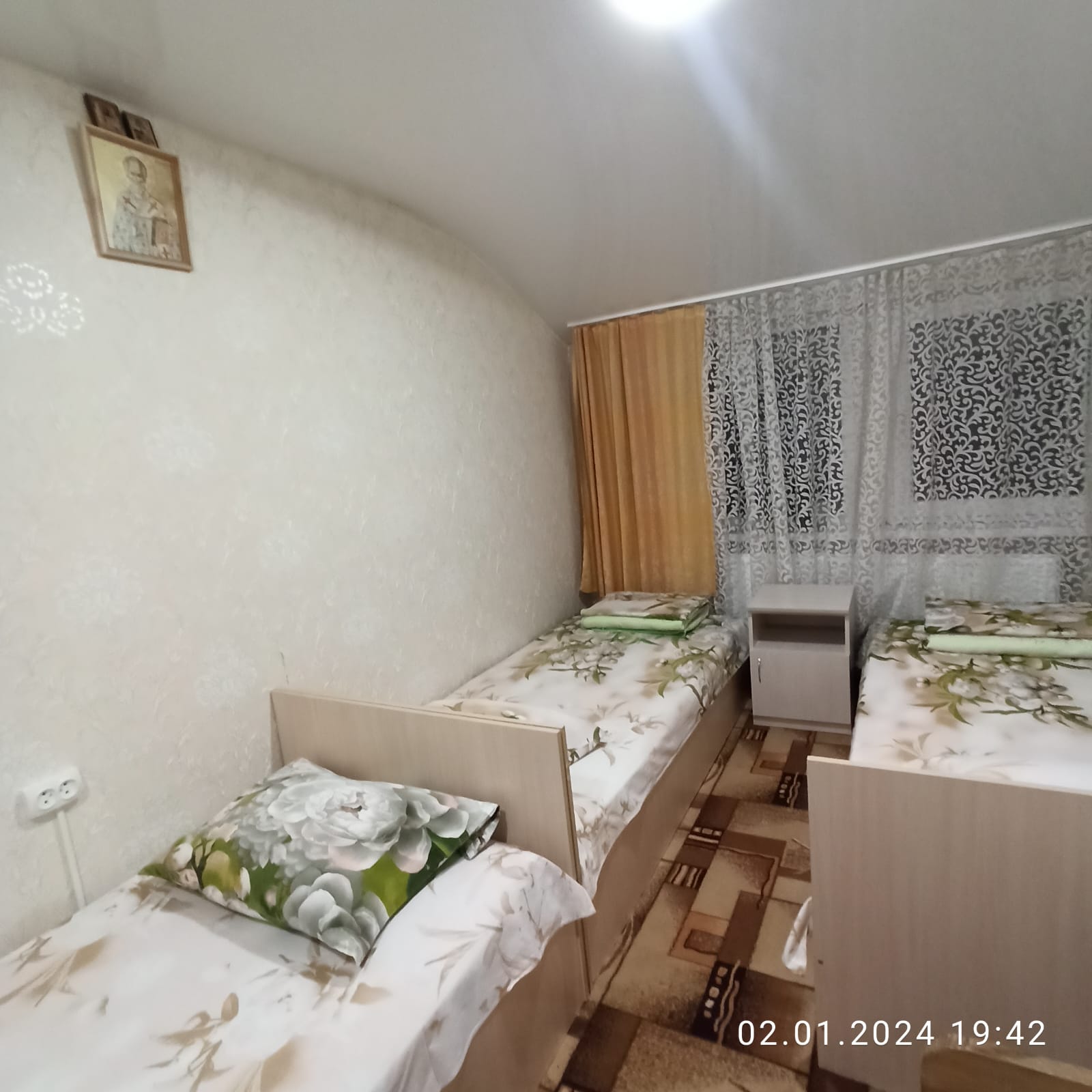 Четырехместный номер эконом-класса с общей ванной комнатой