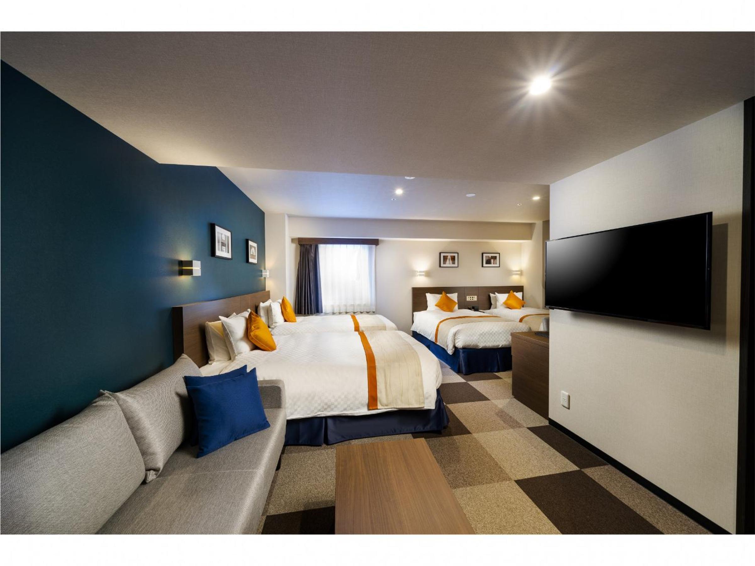 Quadruple Room with four single beds