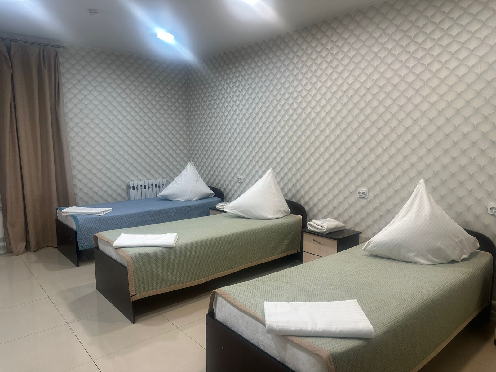 Трехместный номер с тремя односпальными кроватями (койко-место)