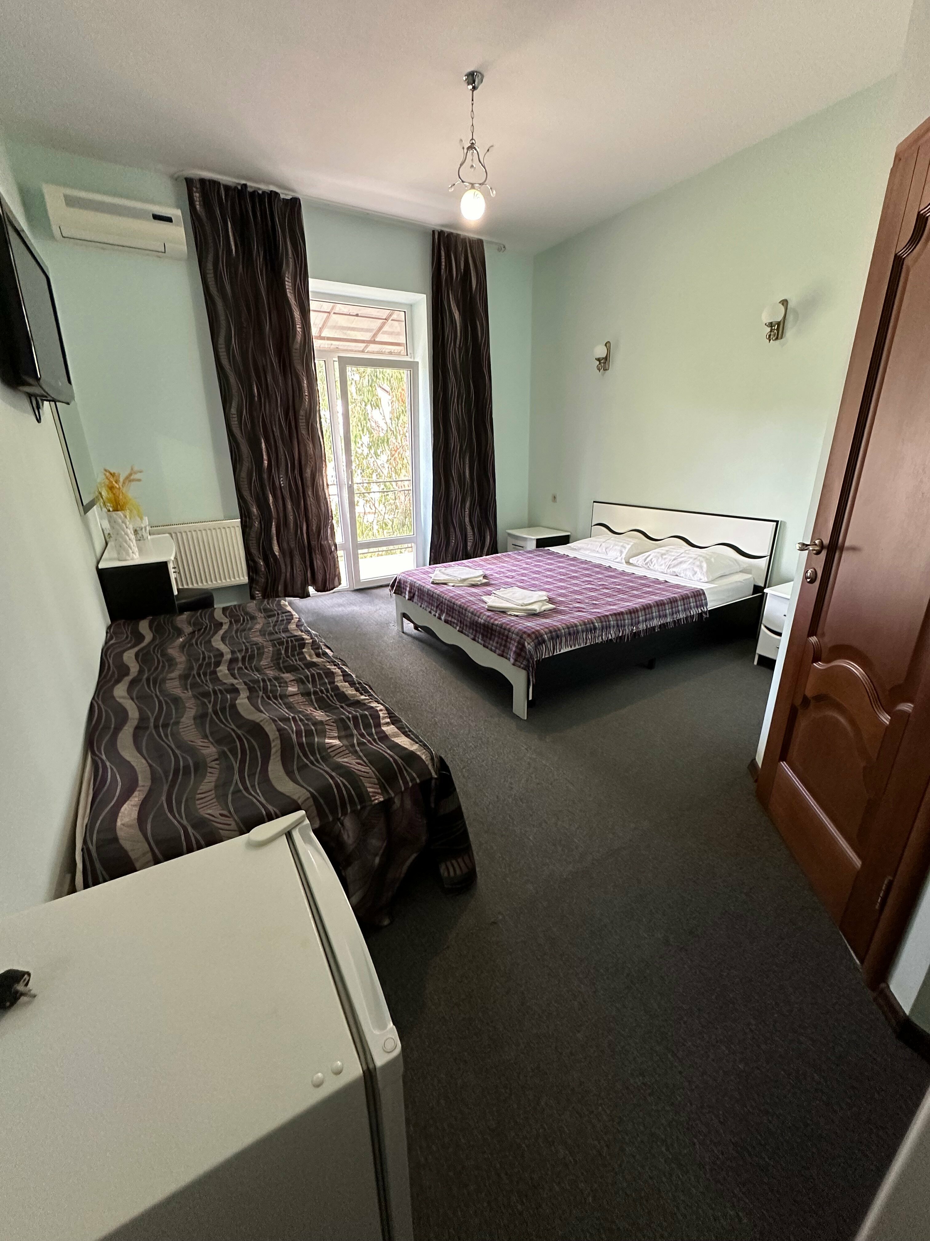 Трехместный номер Делюкс