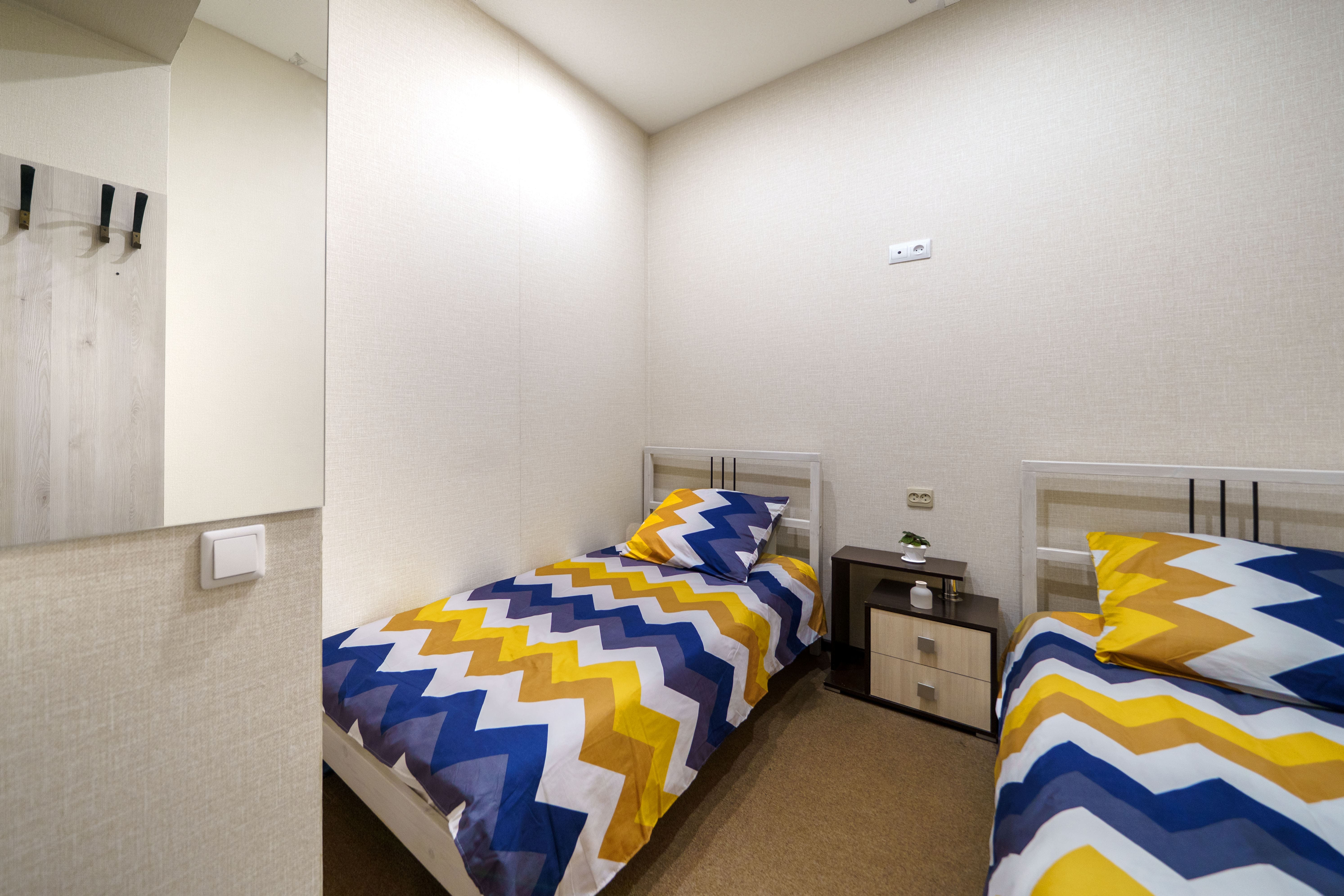 Двухместный номер с 2 отдельными кроватями и общей ванной комнатой