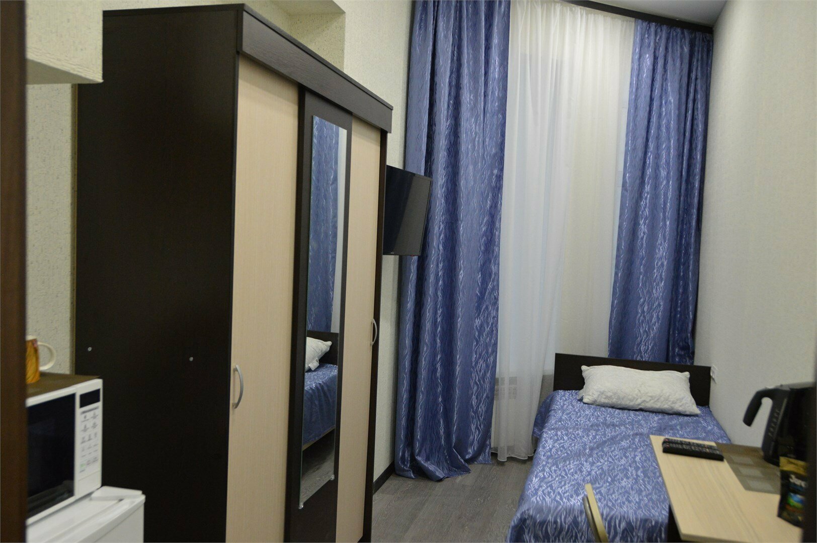 Комната для одного внешней ванной комнатой