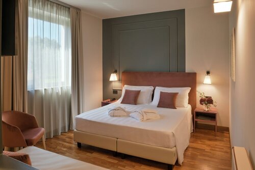 Номер «Джуниор», вид на сад в Hotel Torresi
