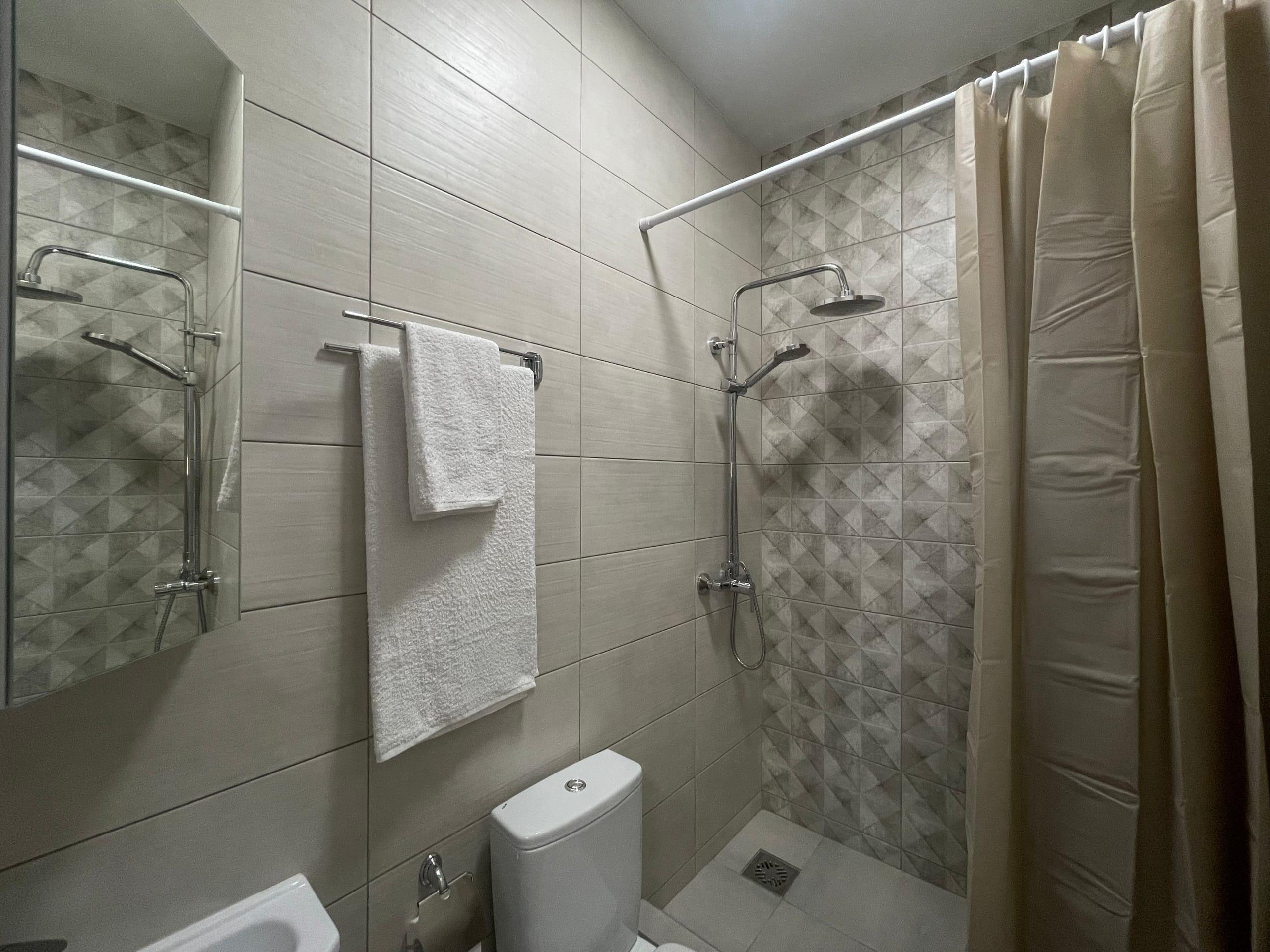 Двухместный номер с 2 отдельными кроватями и душем