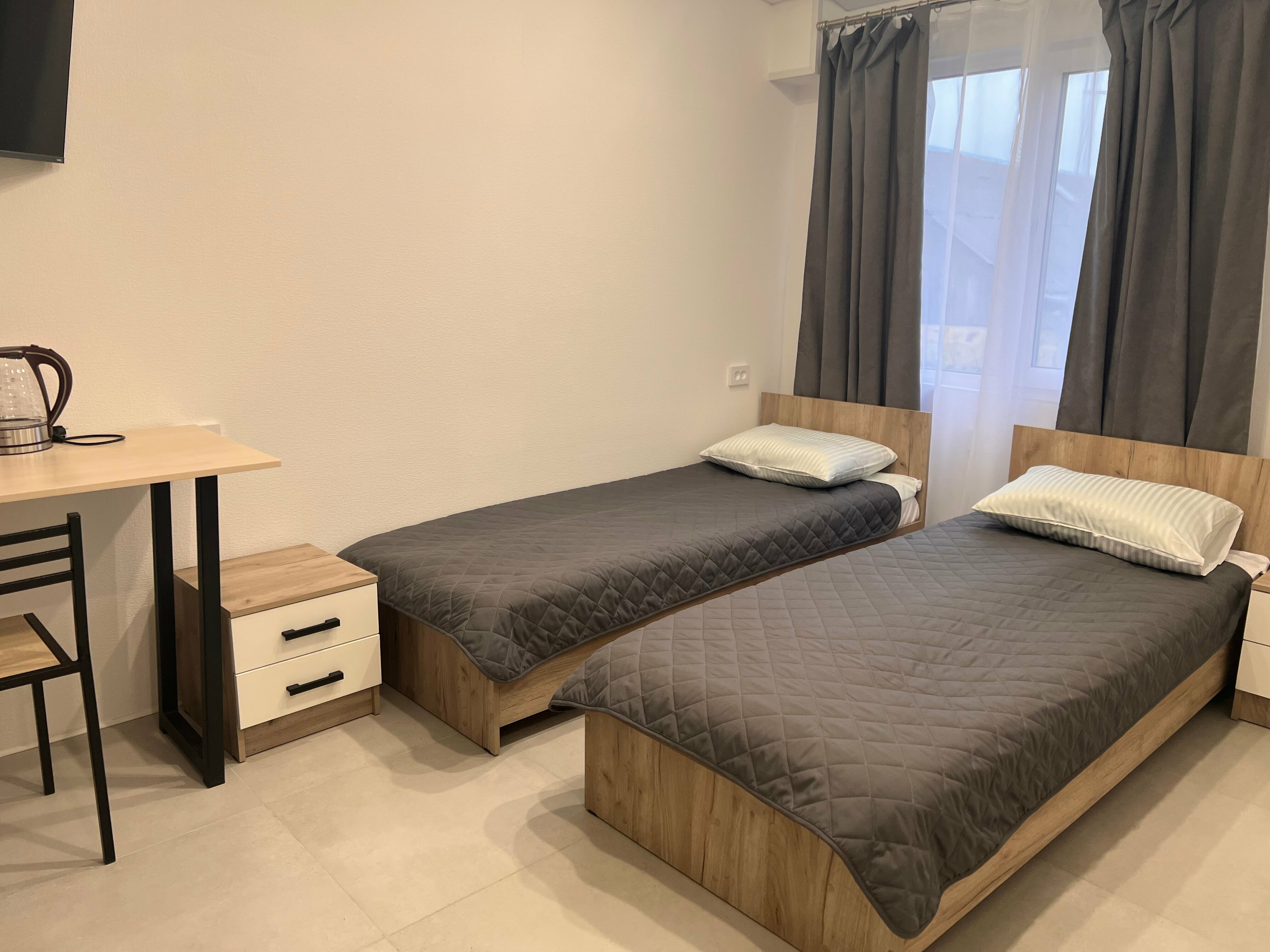 Современный двухместный номер в гостевом доме с отдельными кроватями