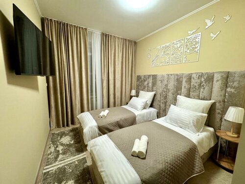 Небольшой двухместный номер с 2 отдельными кроватями