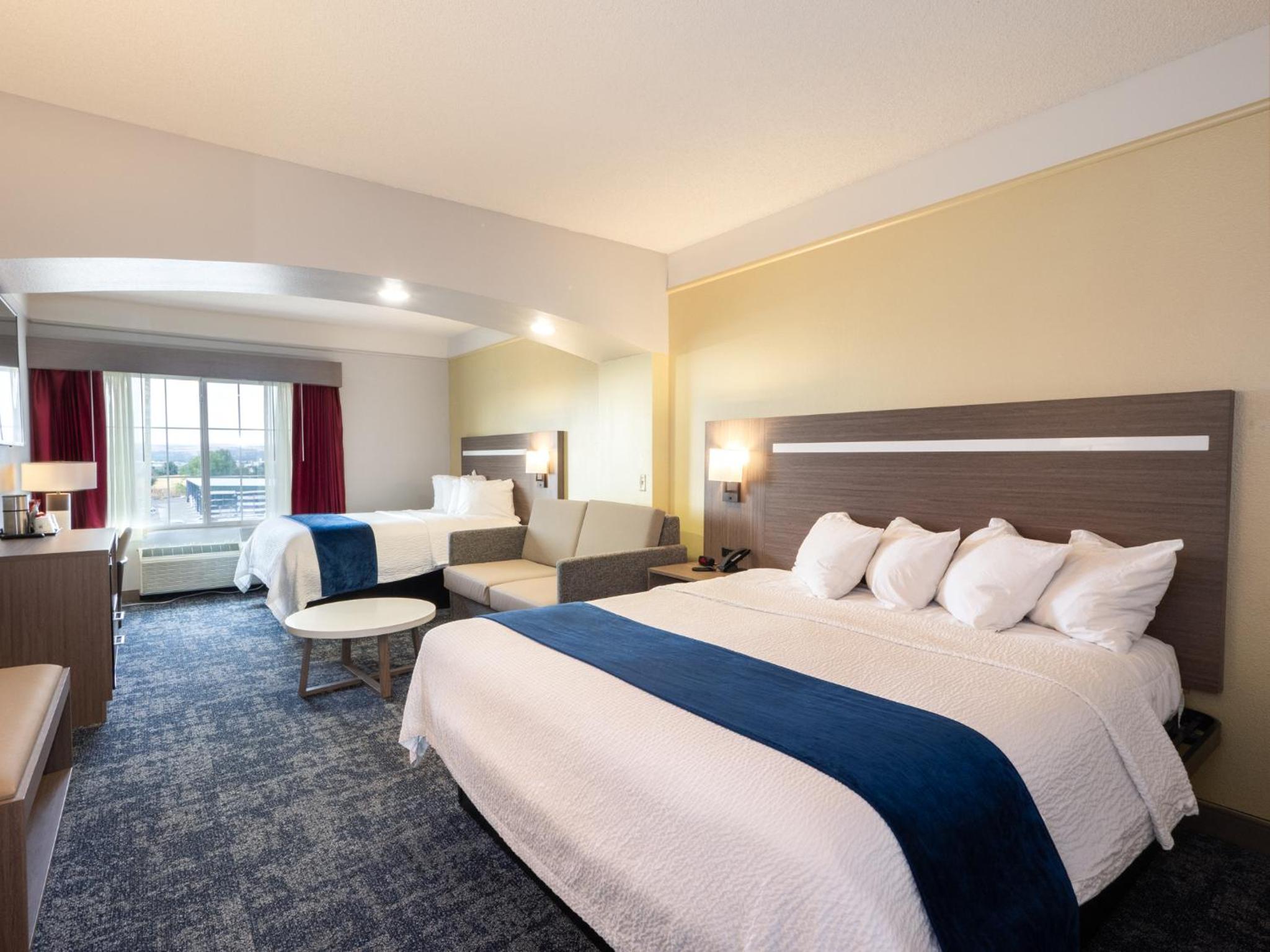 Larger Room with One King and One Queen Bed and Sofa - Non-Smoking