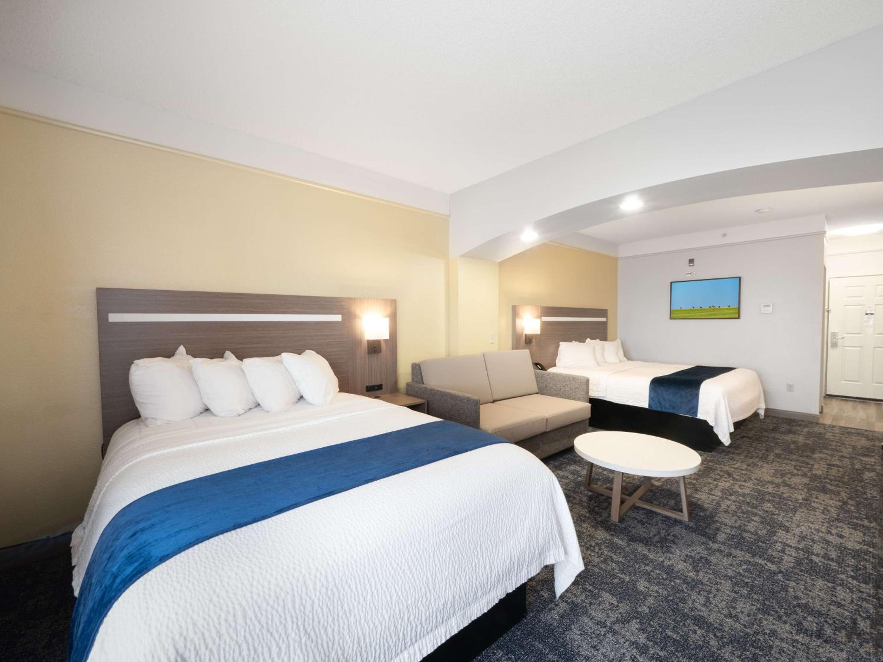Larger Room with One King and One Queen Bed and Sofa - Non-Smoking