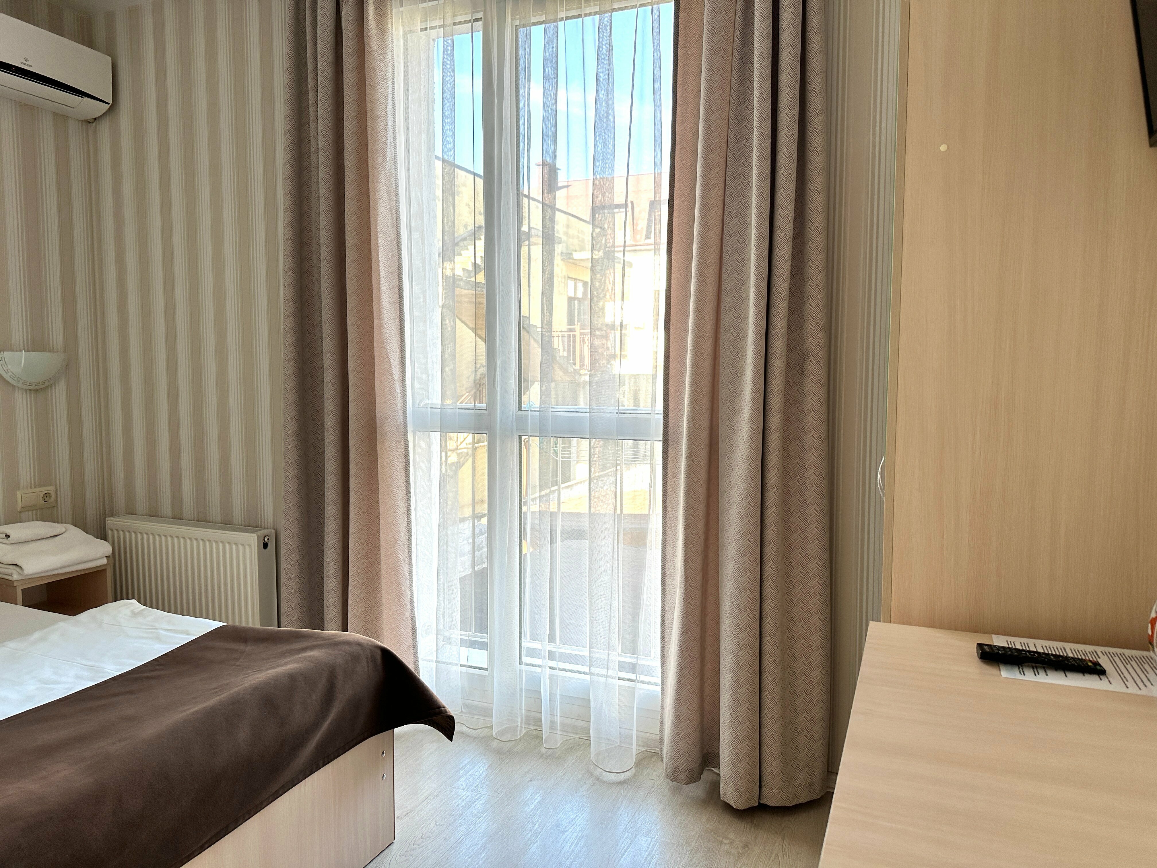 Стандартный двухместный номер с 1 кроватью или 2 отдельными кроватями, вид на сад