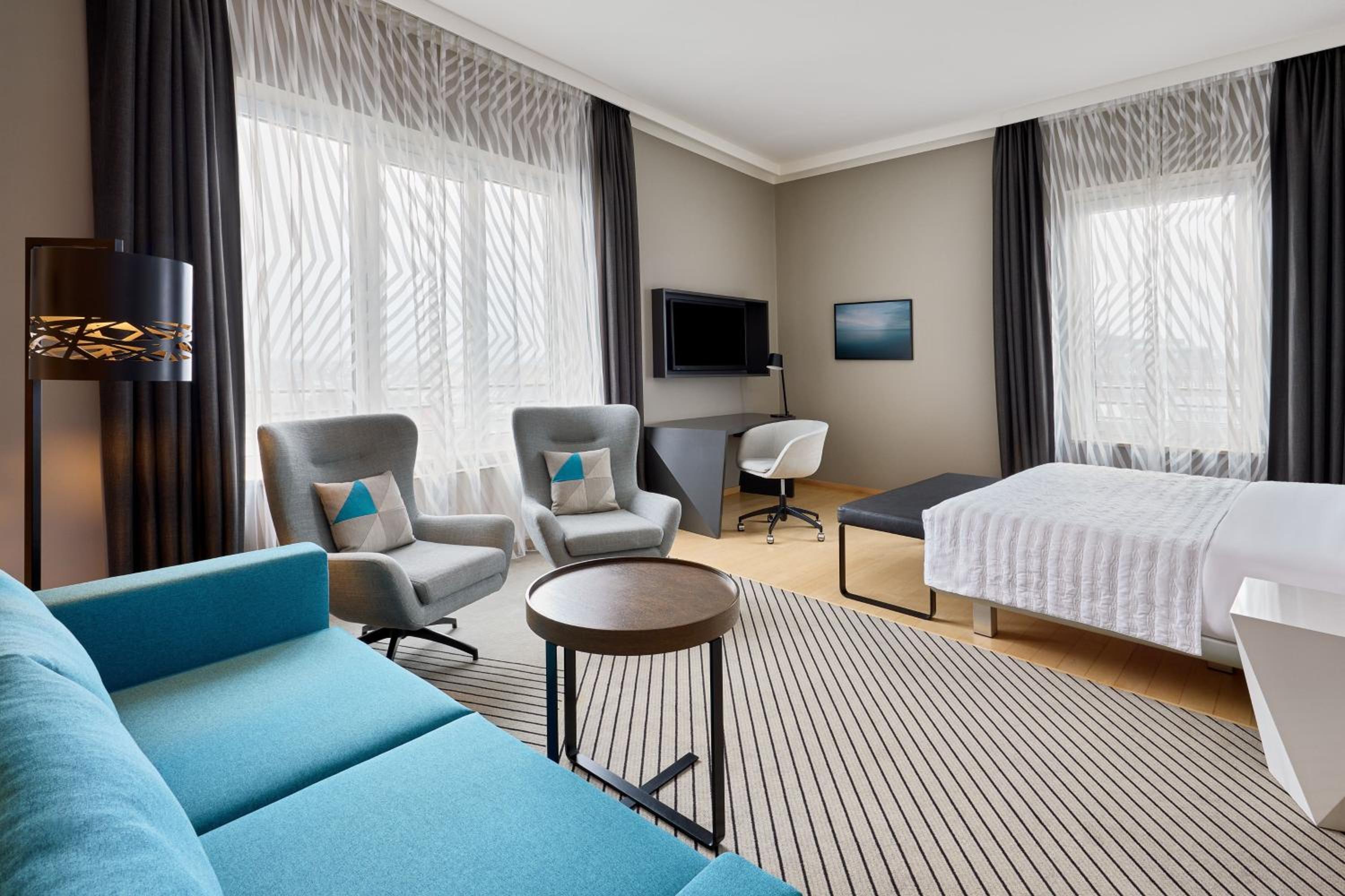 Superior Guest Room with Sofa Bed and Courtyard View