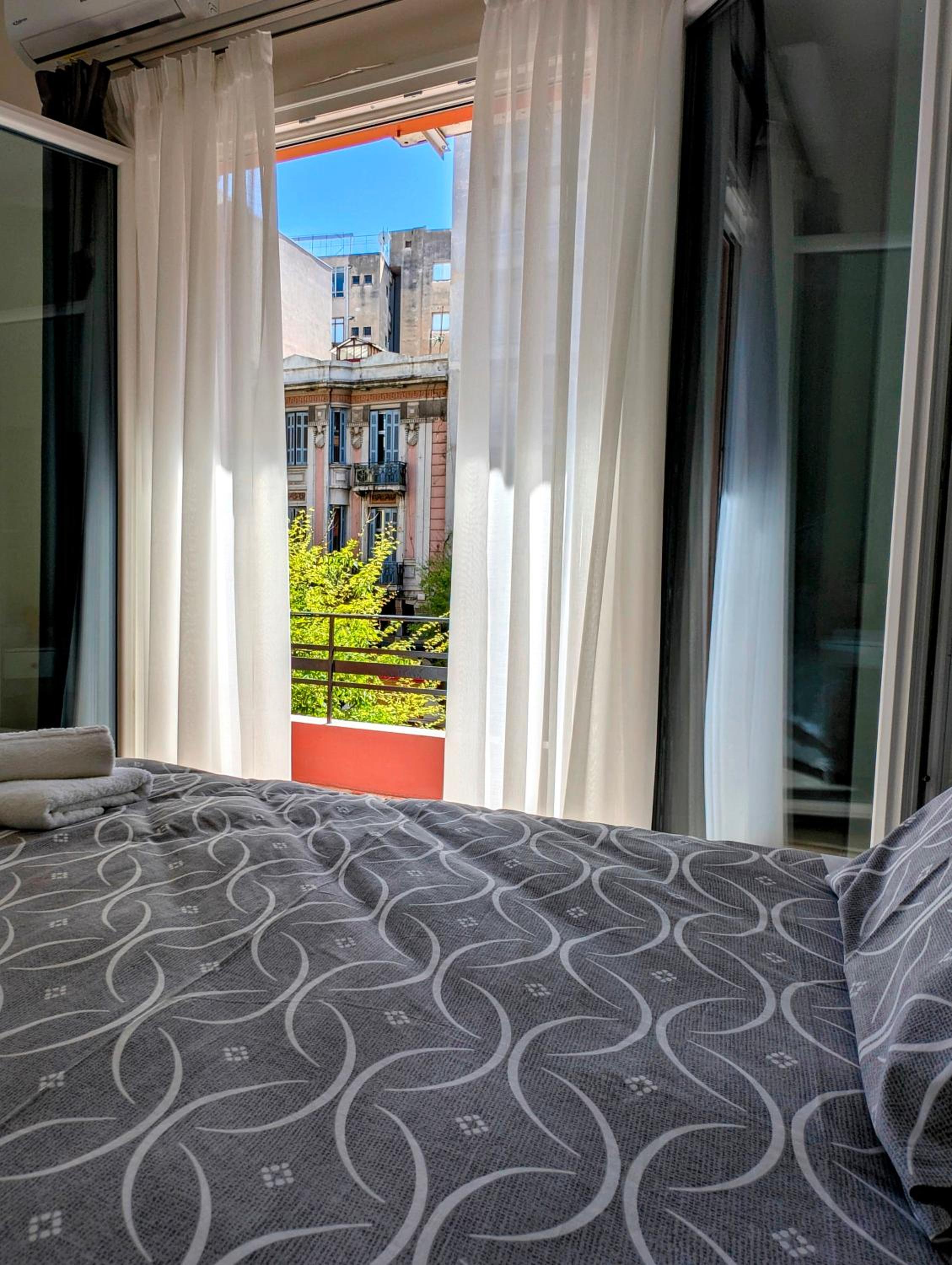 One-Bedroom Apartment with Balcony and City View