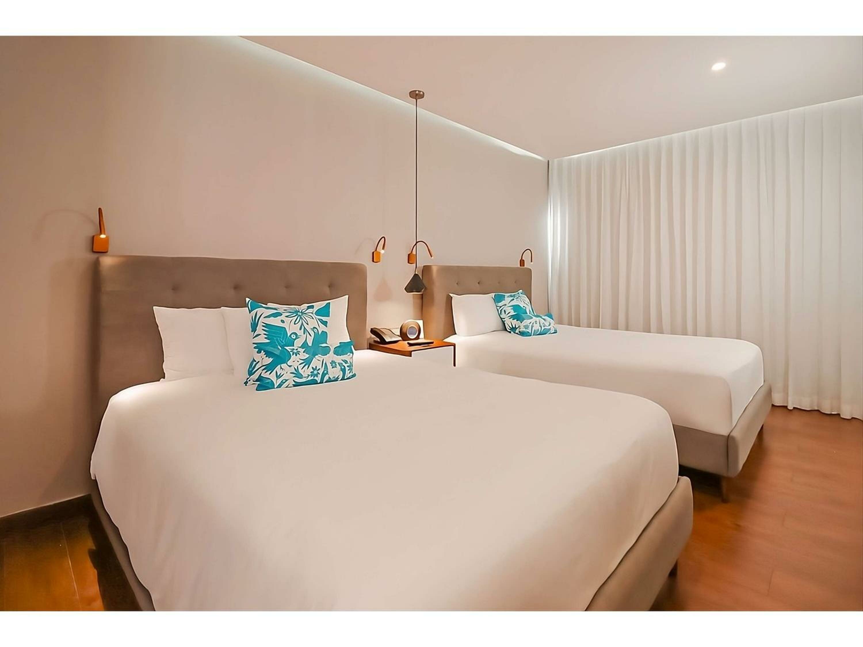 Deluxe Room with Tow Double Beds - Courtyard View