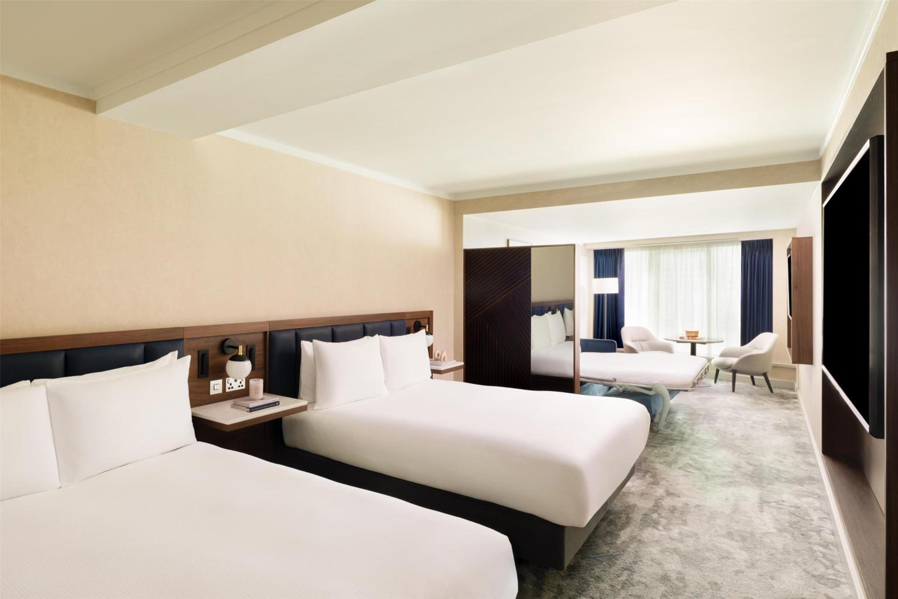 Premium Room with Two Queen Beds and Sofa Bed