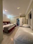Quadruple Room в Rhythm Hotel