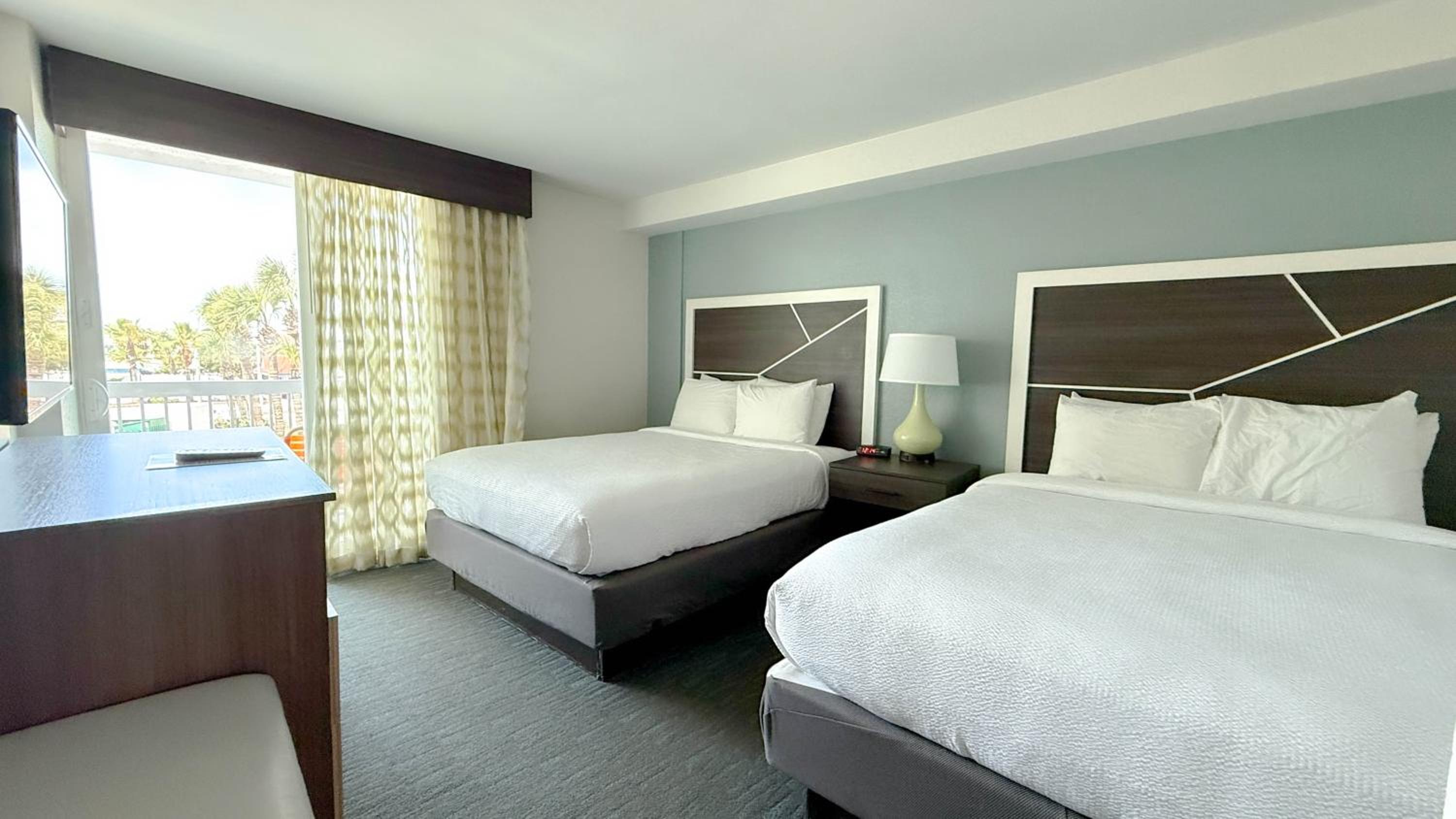 Two-Room Queen Suite with Two Queen Beds, Sofa Bed, Balcony, Partial Ocean View and Kitchenette - Non-Smoking